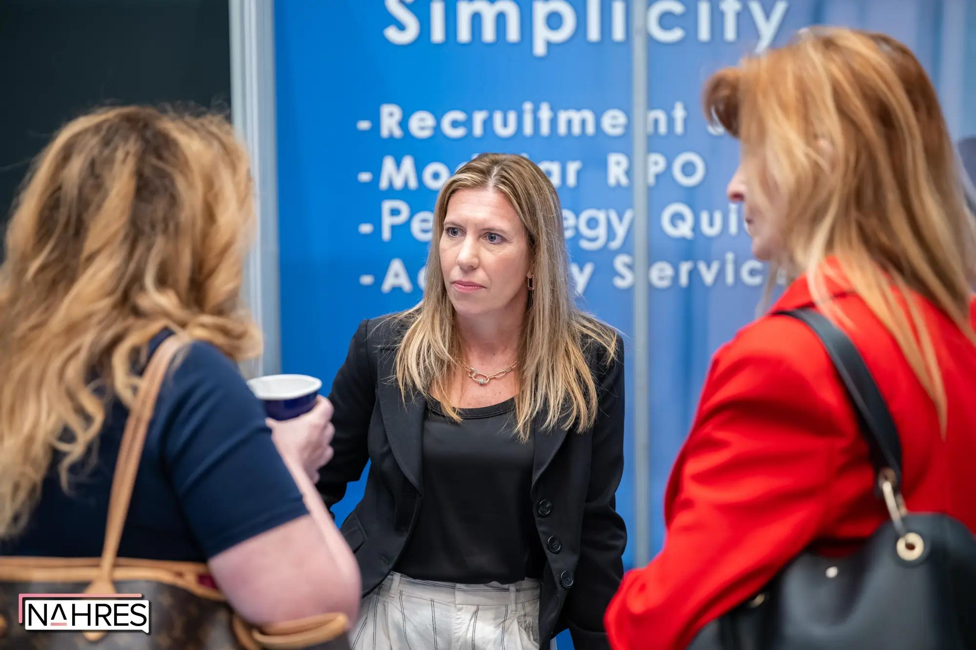 Jamie in peer conversations at a conference