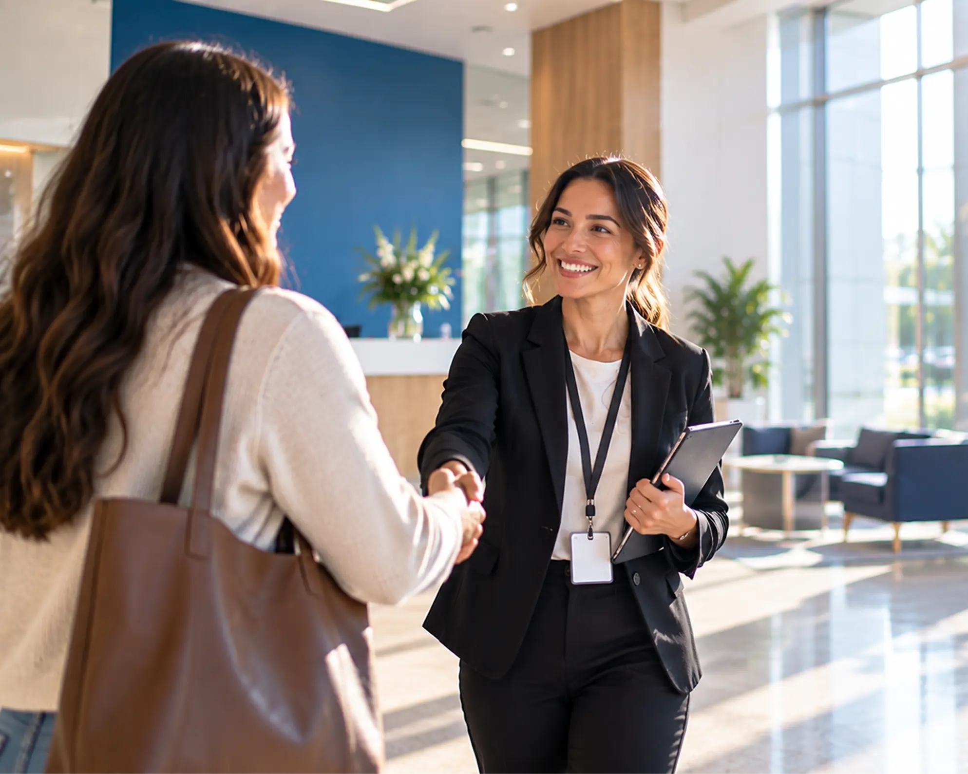 A recruiter and candidate talking at an outdoor table