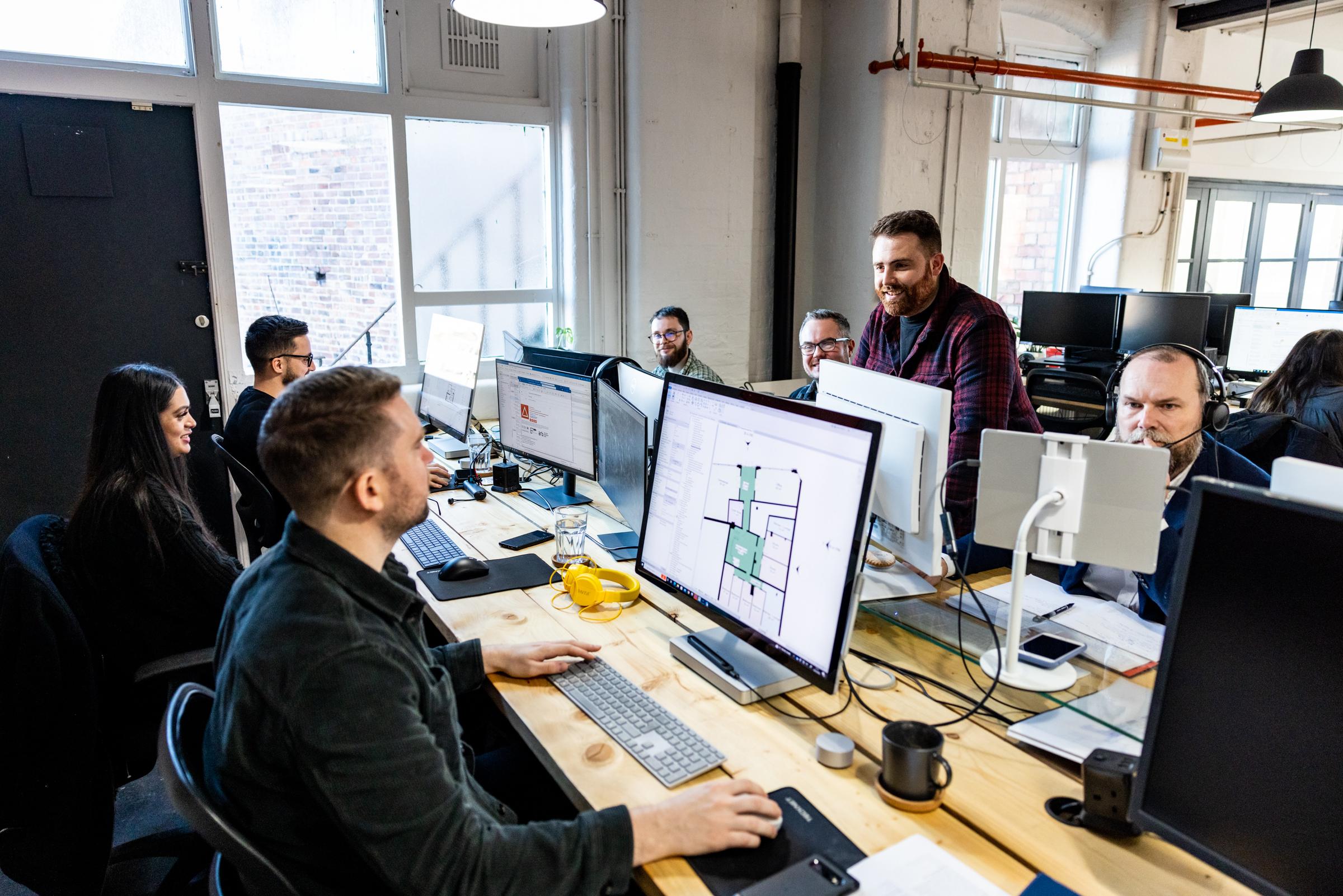 Some members of Arc Design Studio gathered around some work