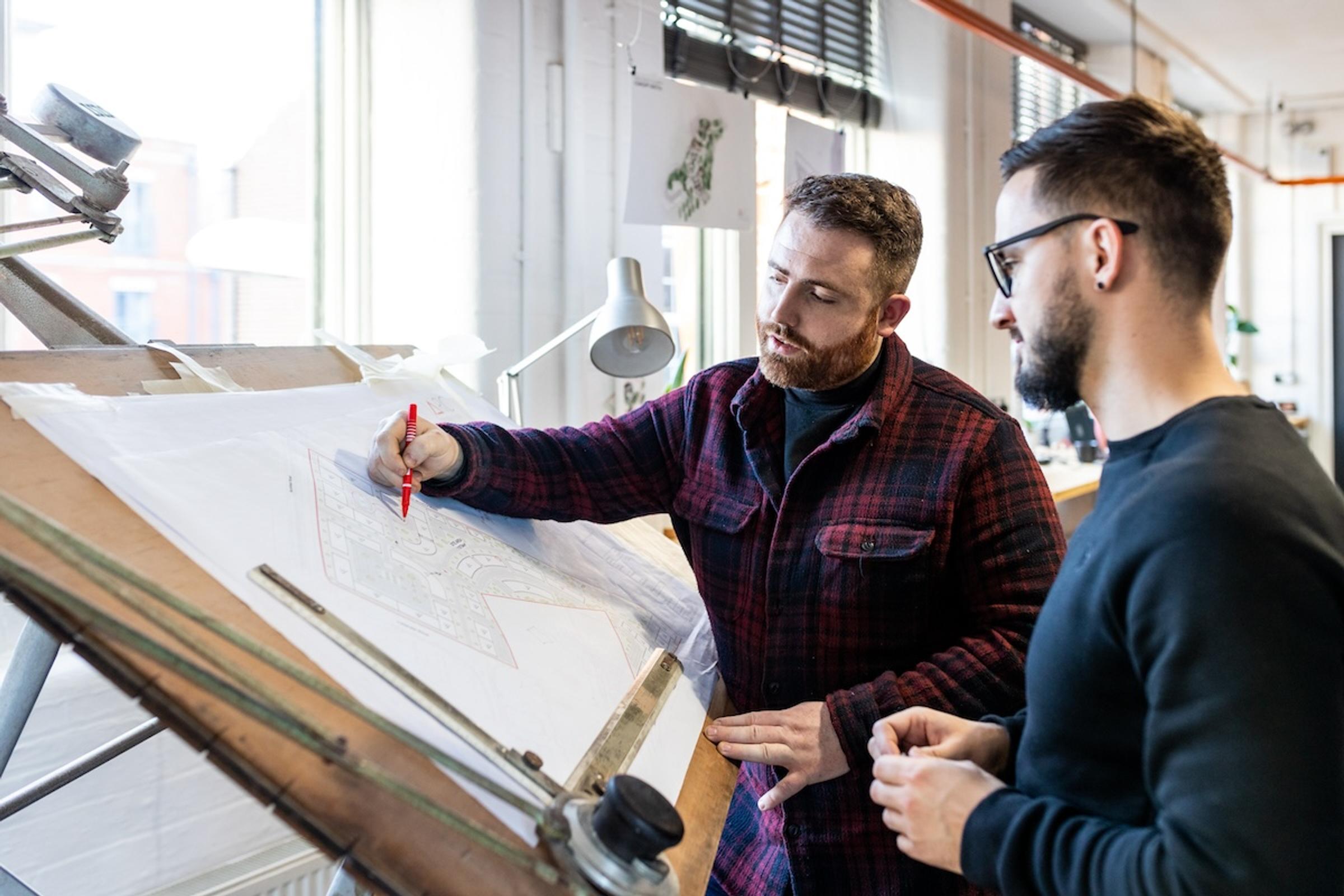 Some members of Arc Design Studio gathered around some work