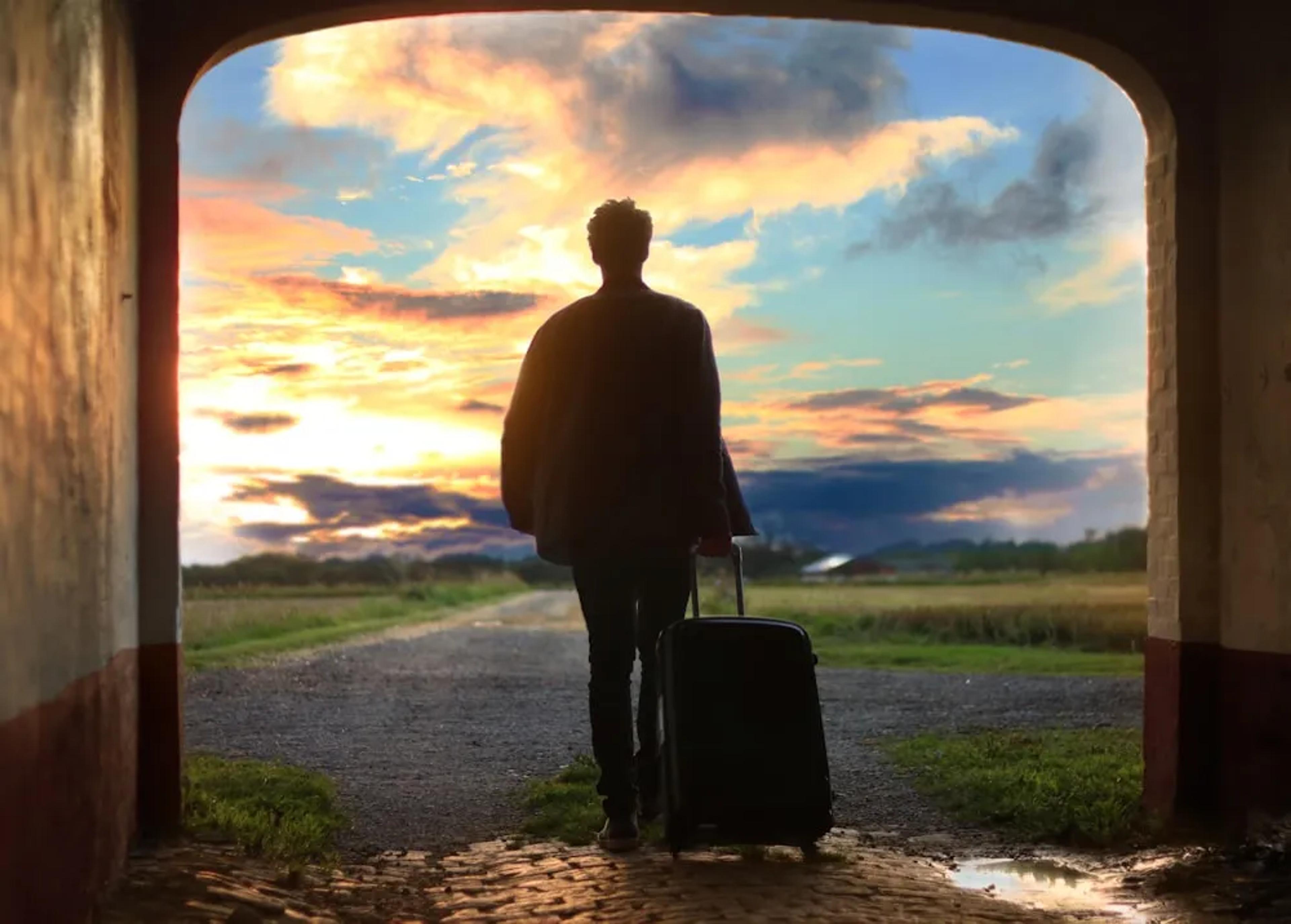 Man with briefcase back to viewer