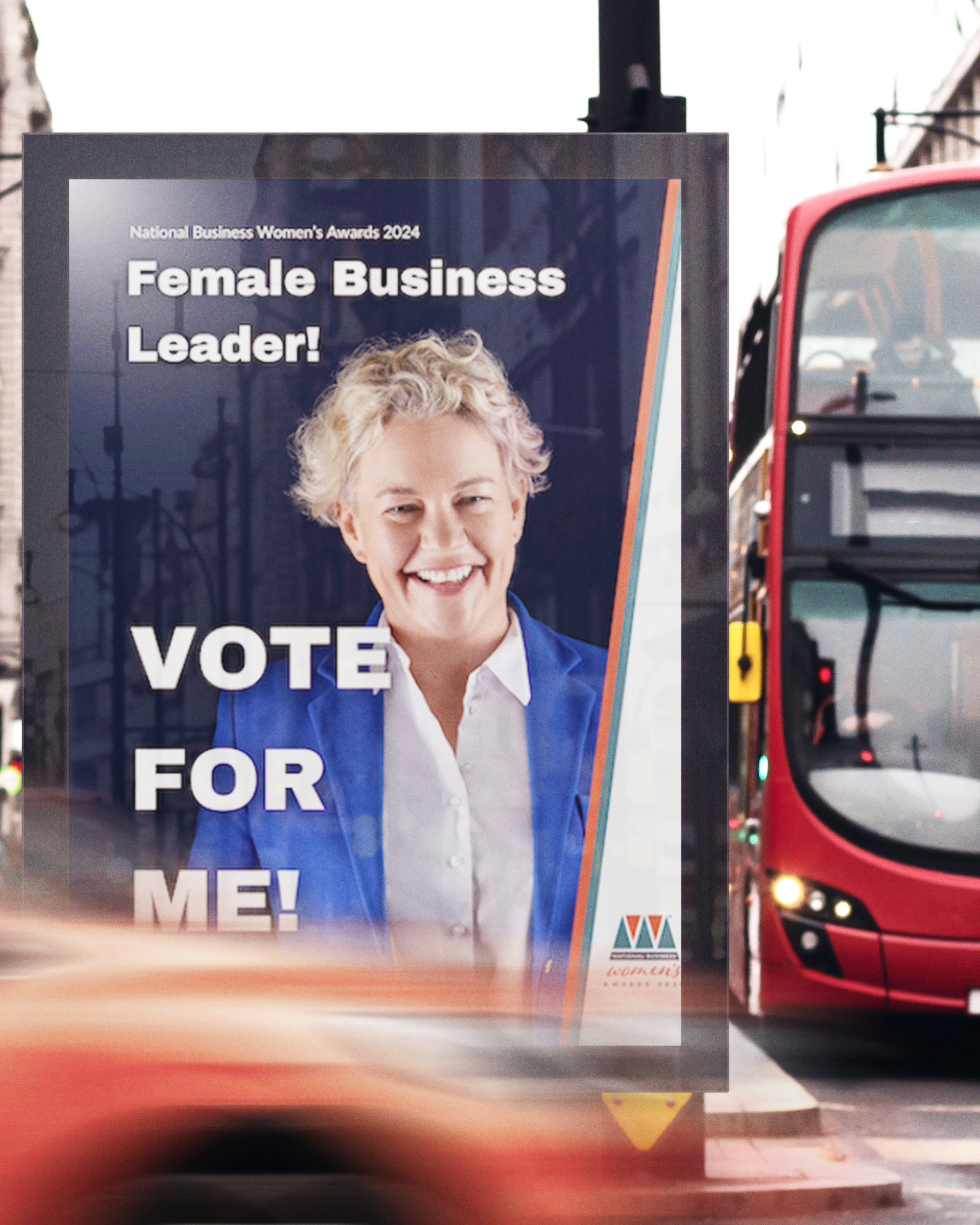 A busy London street with a digital out of home ad. The ad depicts a smiling Rachel Murphy and the texts 'Female Business Leader! Vote for me!