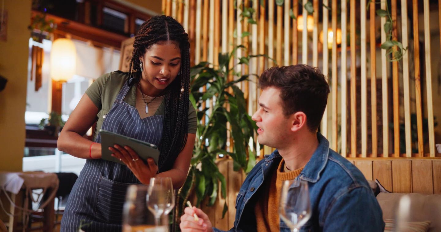 wait staff taking orders on custom ordering application