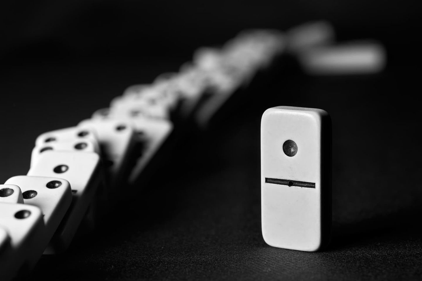 dominos falling in place to represent reduction of errors with custom software