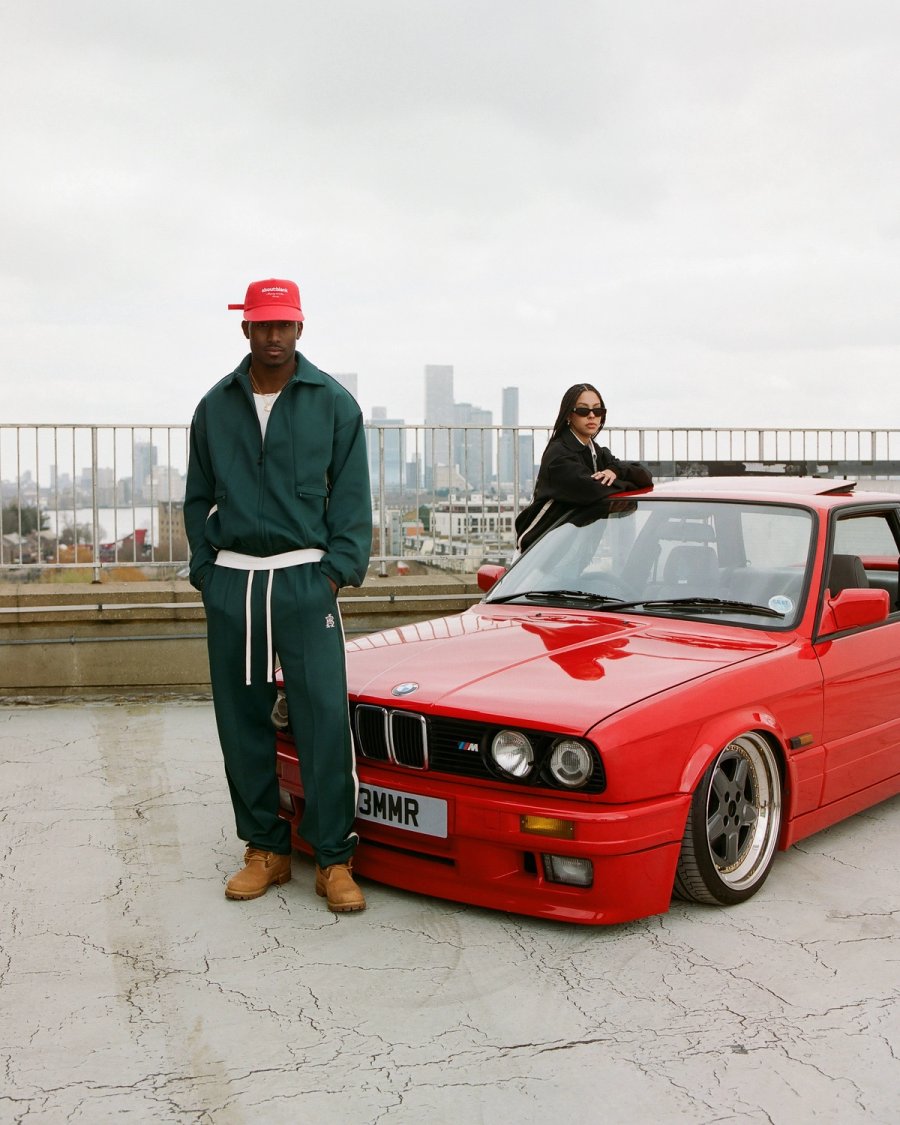 red classic bmw with models stood infront