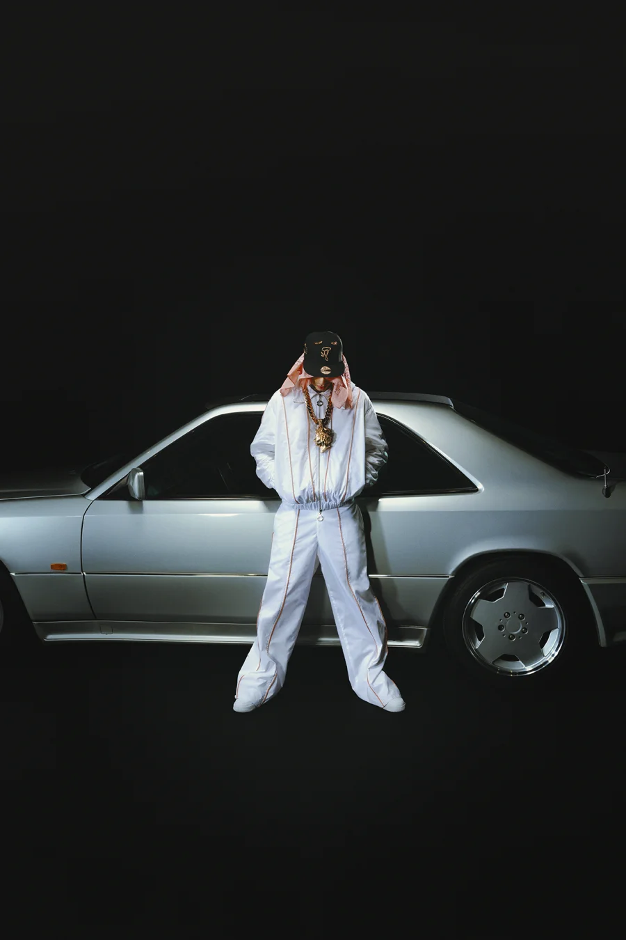 Central Cee stood in front of a Mercedes