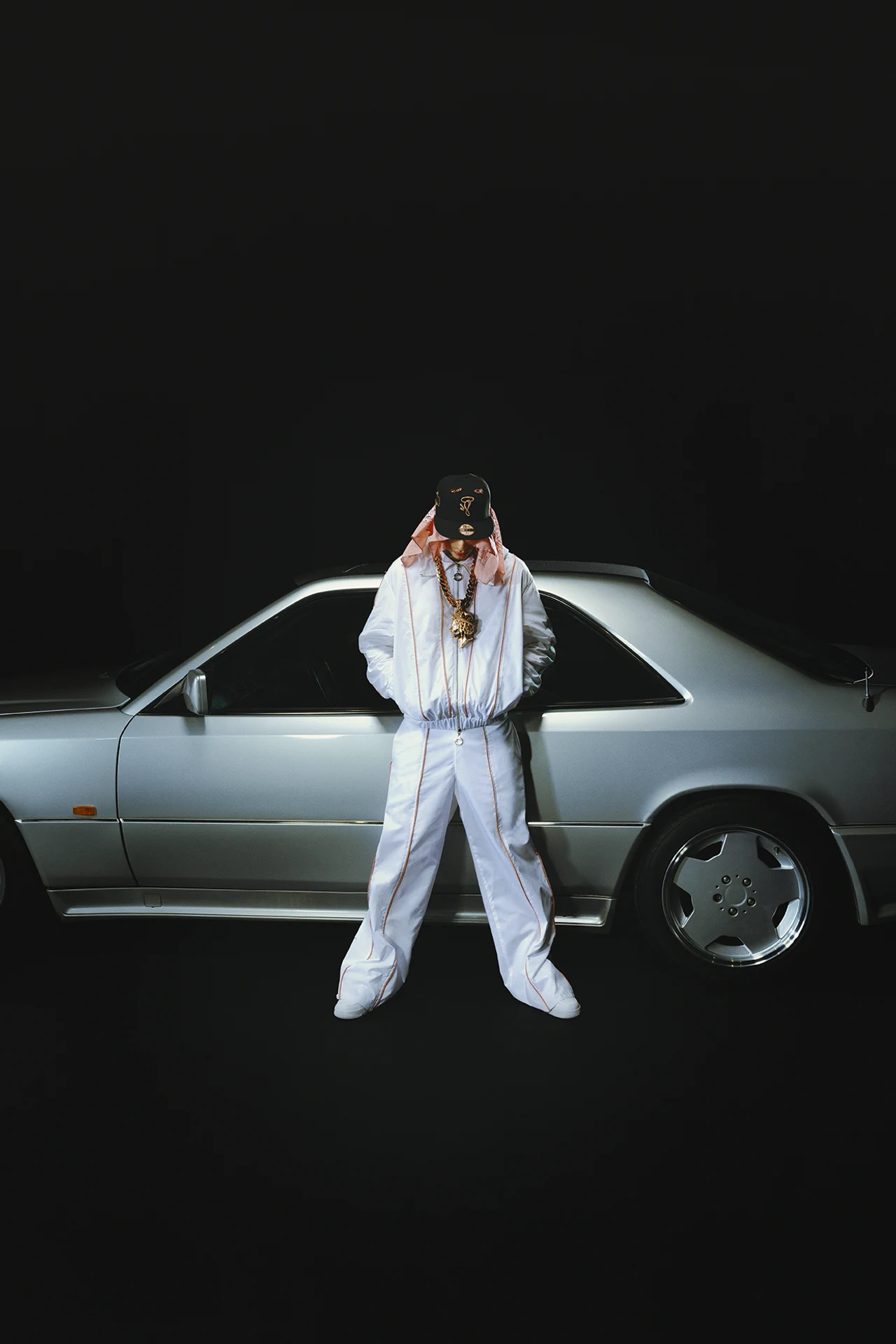 Central Cee stood in front of a Mercedes