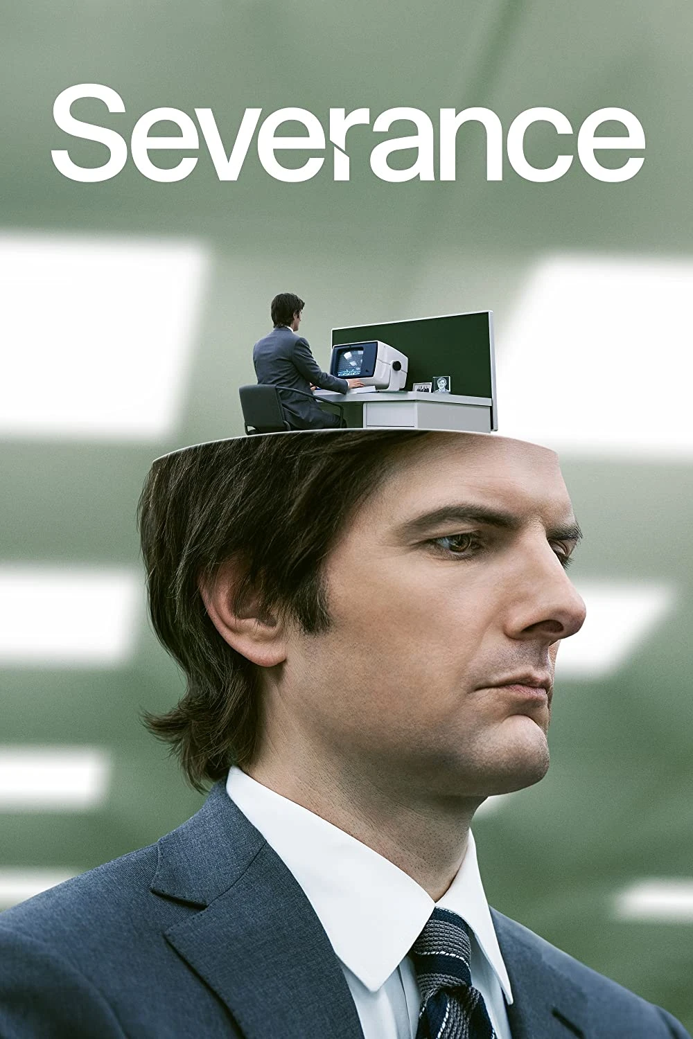 Promotional poster for the series “Severance,” featuring a man in a suit with the top of his head opened to reveal a smaller version of himself working at a desk in a sterile office setting.