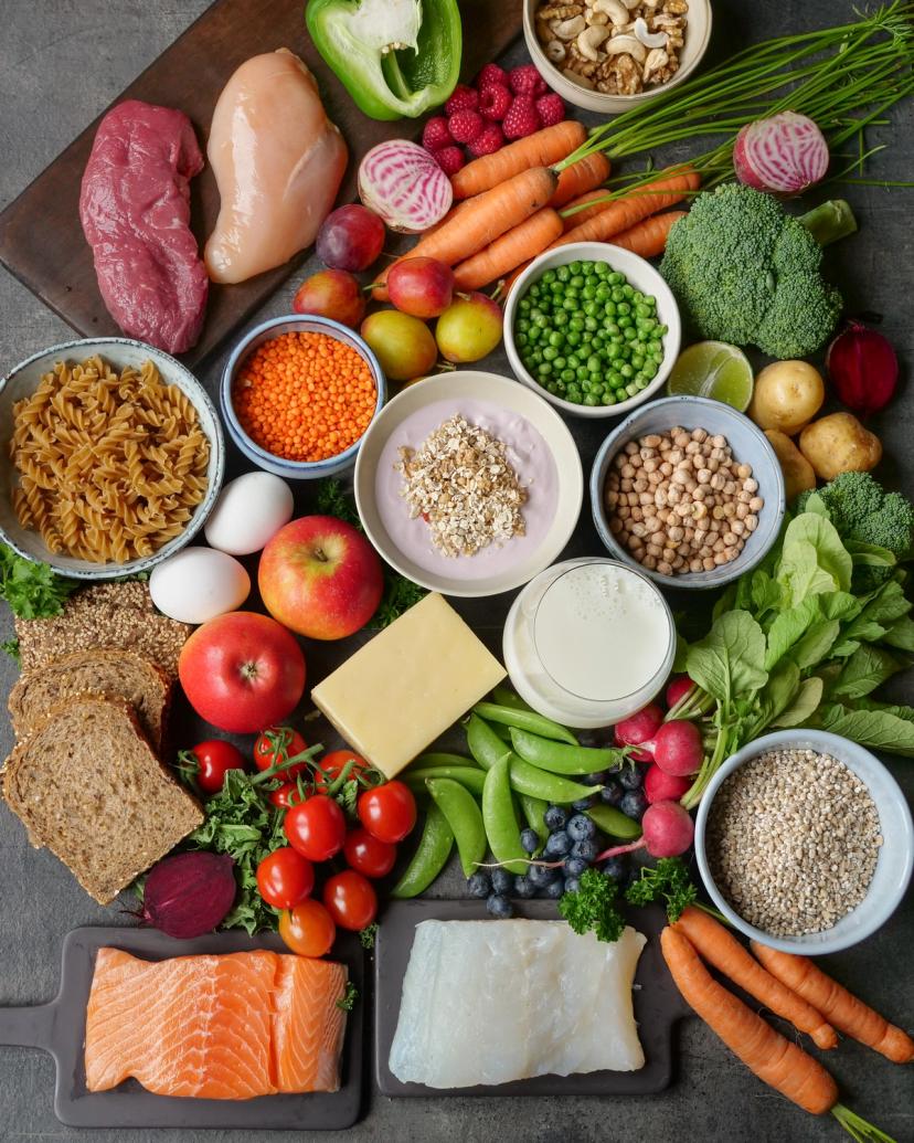 a variety of healthy foods are laid out on a table