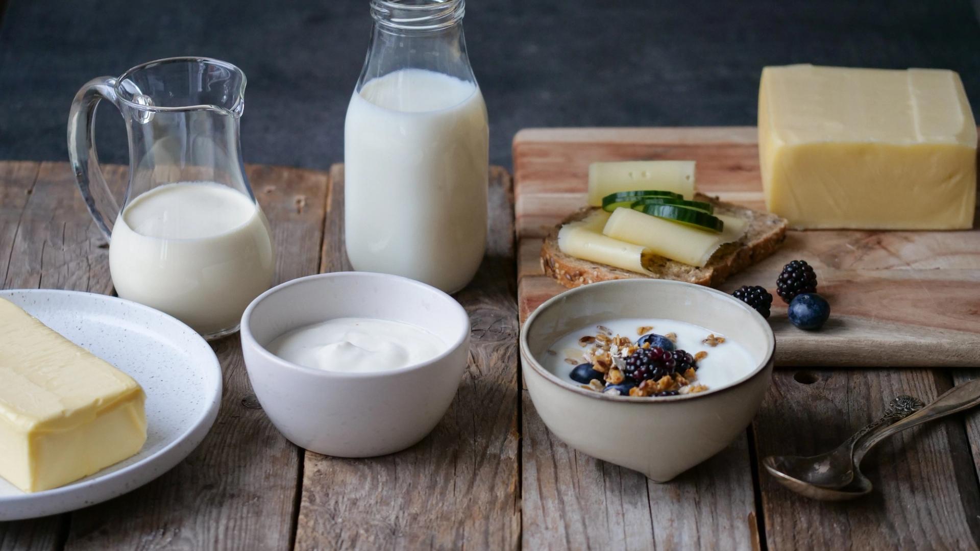 there are many different types of dairy products on the table .