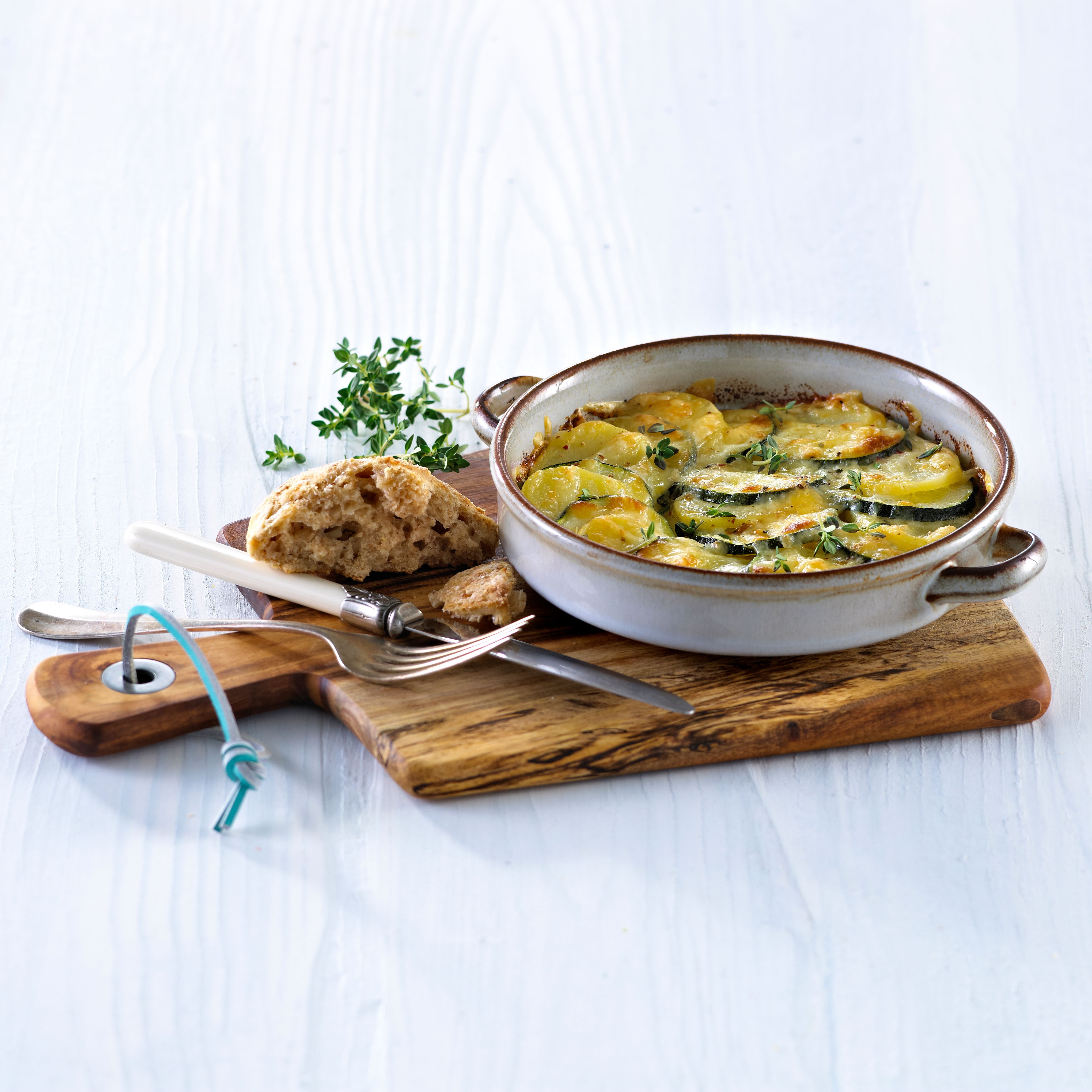 Poteter og squash med ost og urter