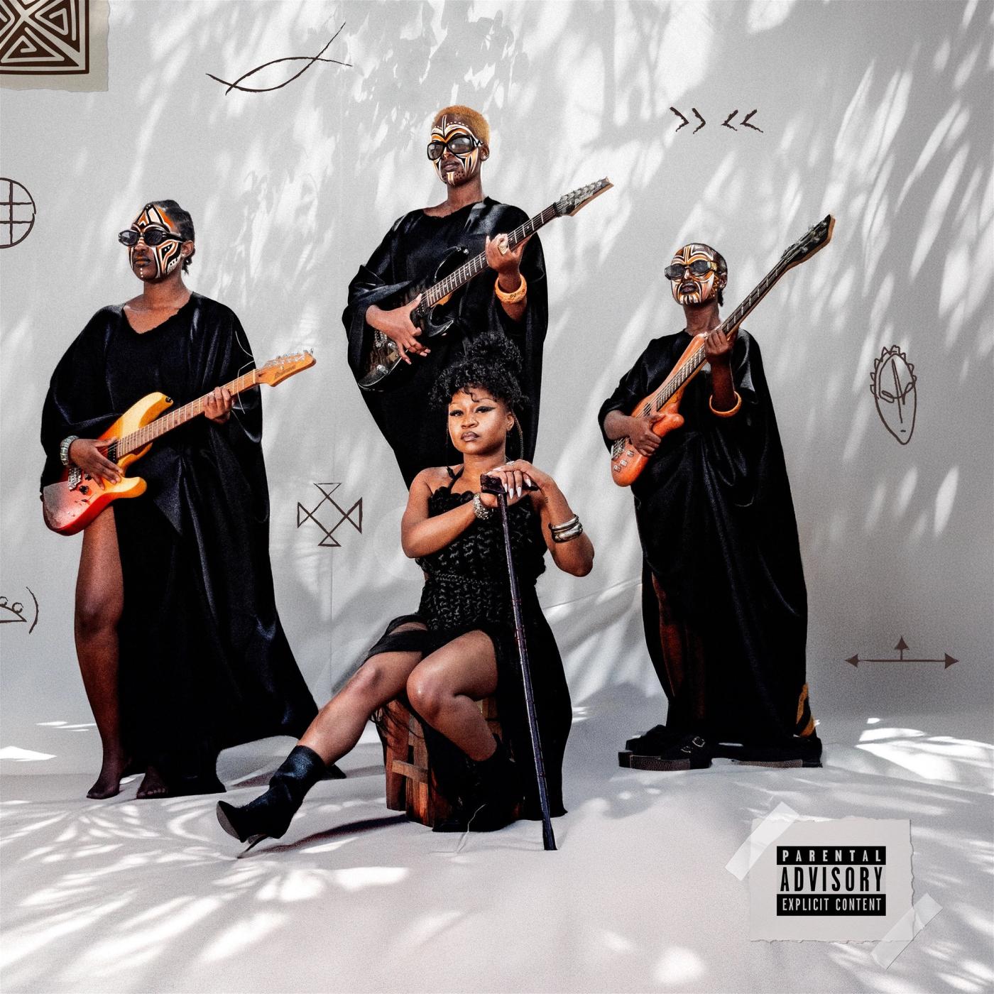 Nu Zamrock album cover: a woman in black seated with a cane before three robed guitarists in face paint and sunglasses on a white set