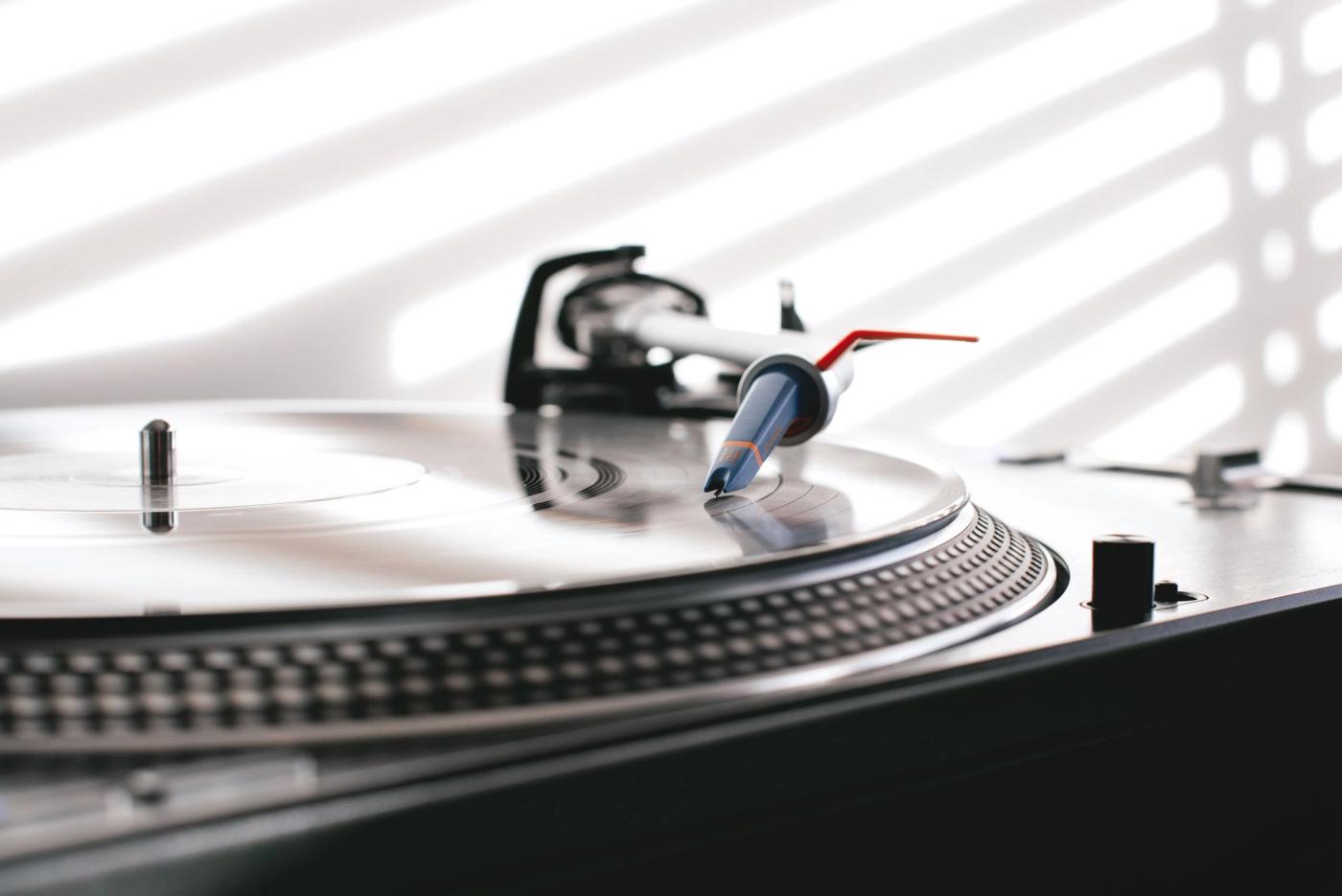 A vinyl record spinning on a turntable with the needle down