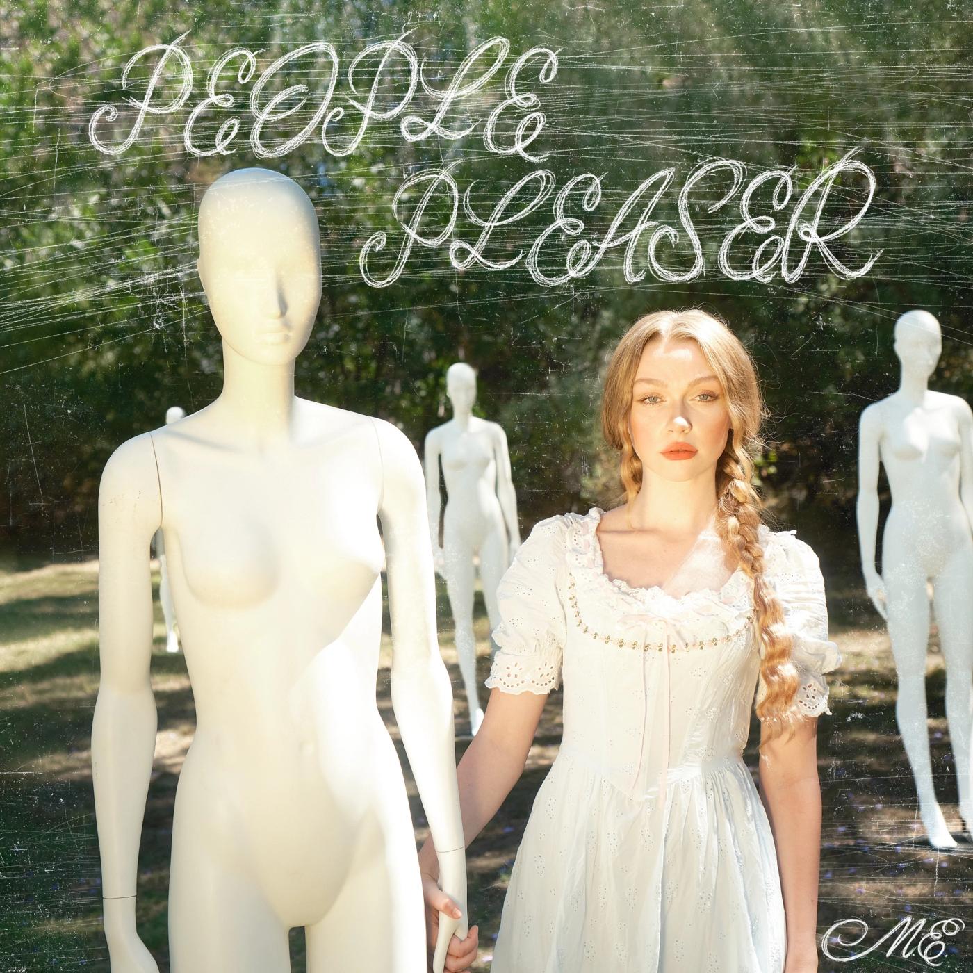 Mollie Elizabeth in a white dress stands among white mannequins outdoors under the words PEOPLE PLEASER
