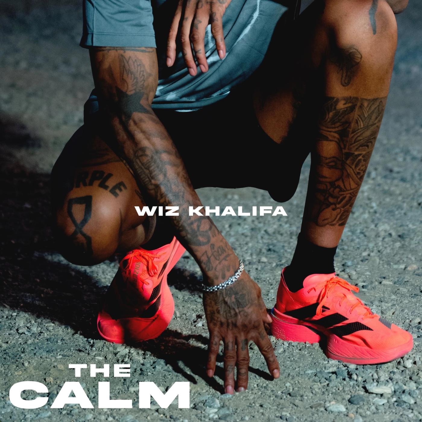 The Calm single artwork as listed on Apple Music: Wiz Khalifa crouching in red sneakers
