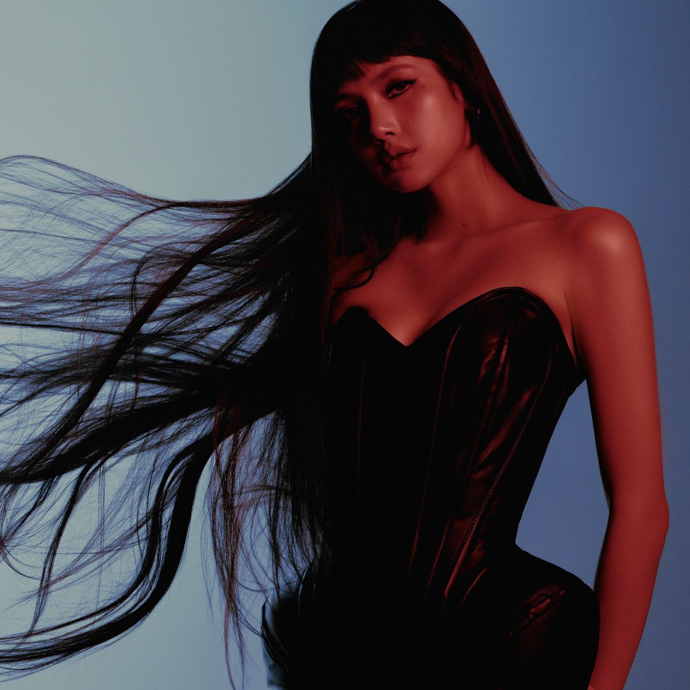 LISA in a black strapless top with long hair blowing sideways on the PRESS PLAY EP cover