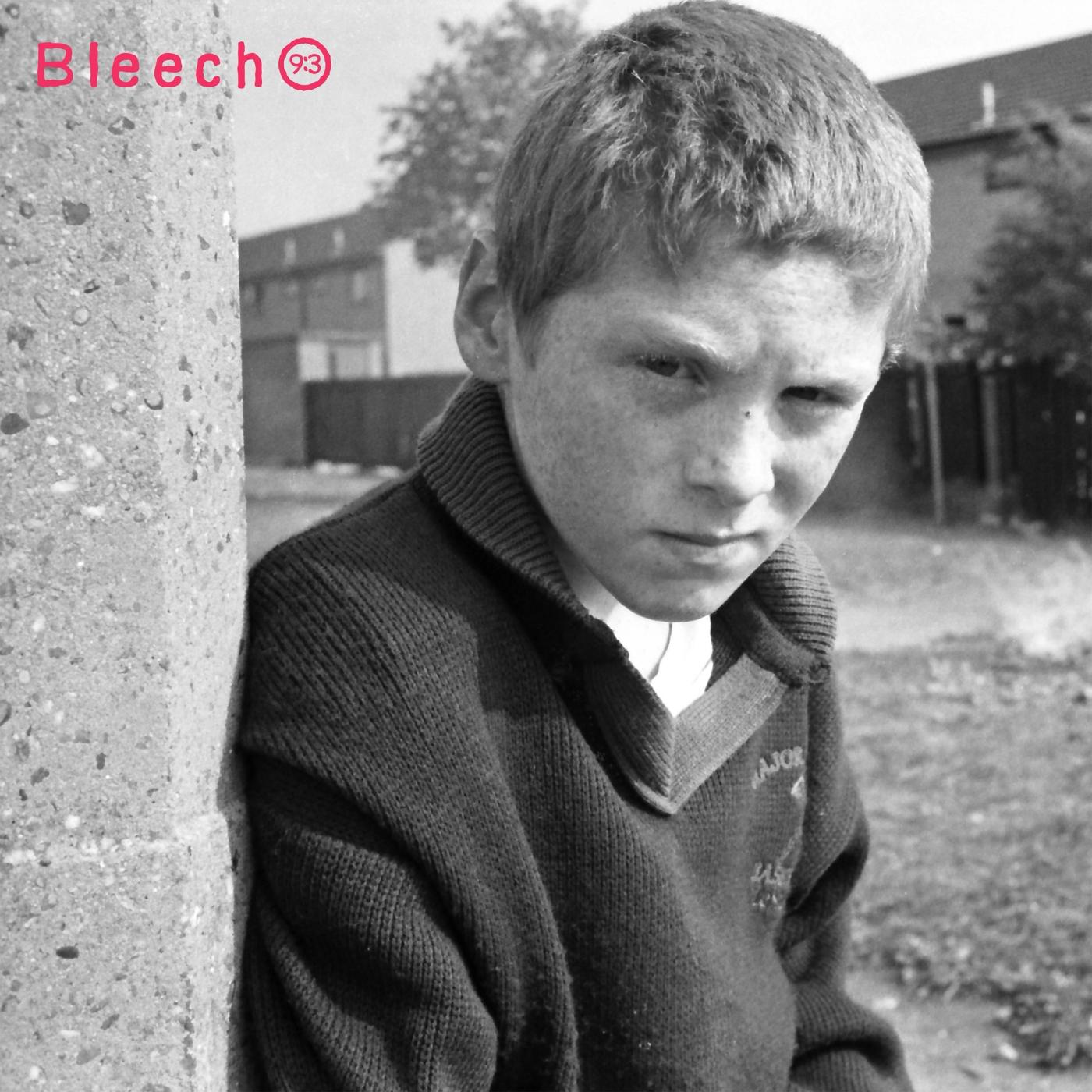 Bleech 9:3 EP cover: black and white photo of a freckled boy in a dark knit sweater leaning on a concrete post, band name in pink at top left