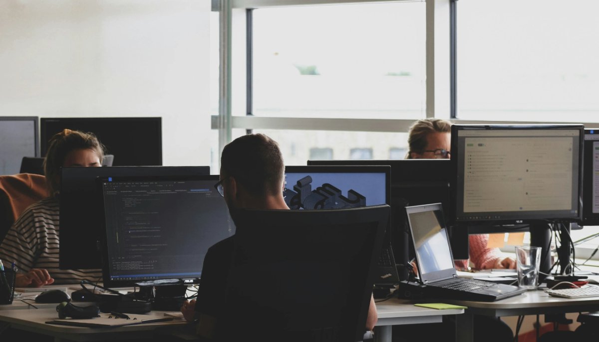Office with computers. People working. 