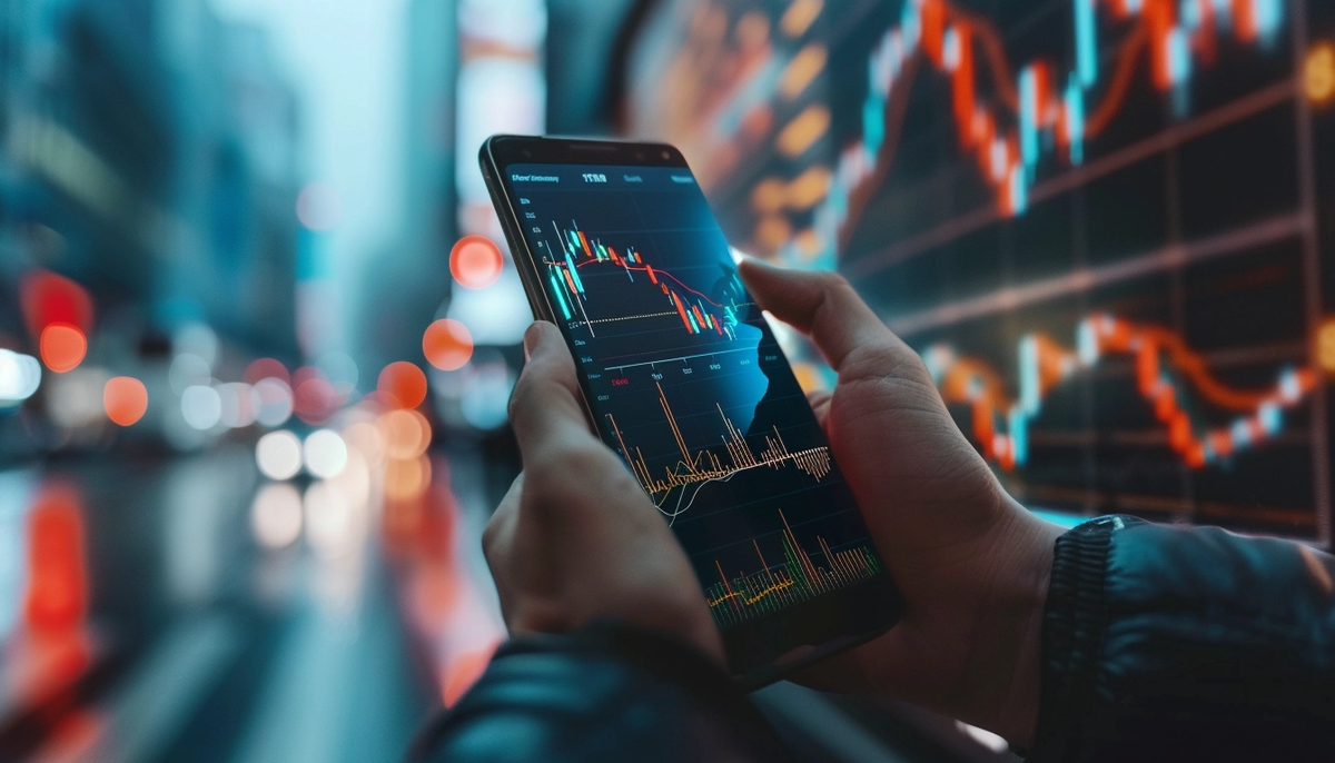 Real-world Examples of Business Analysts Driving Success in Software Projects. Smartphone in the hands with data and graphics on the screen. 