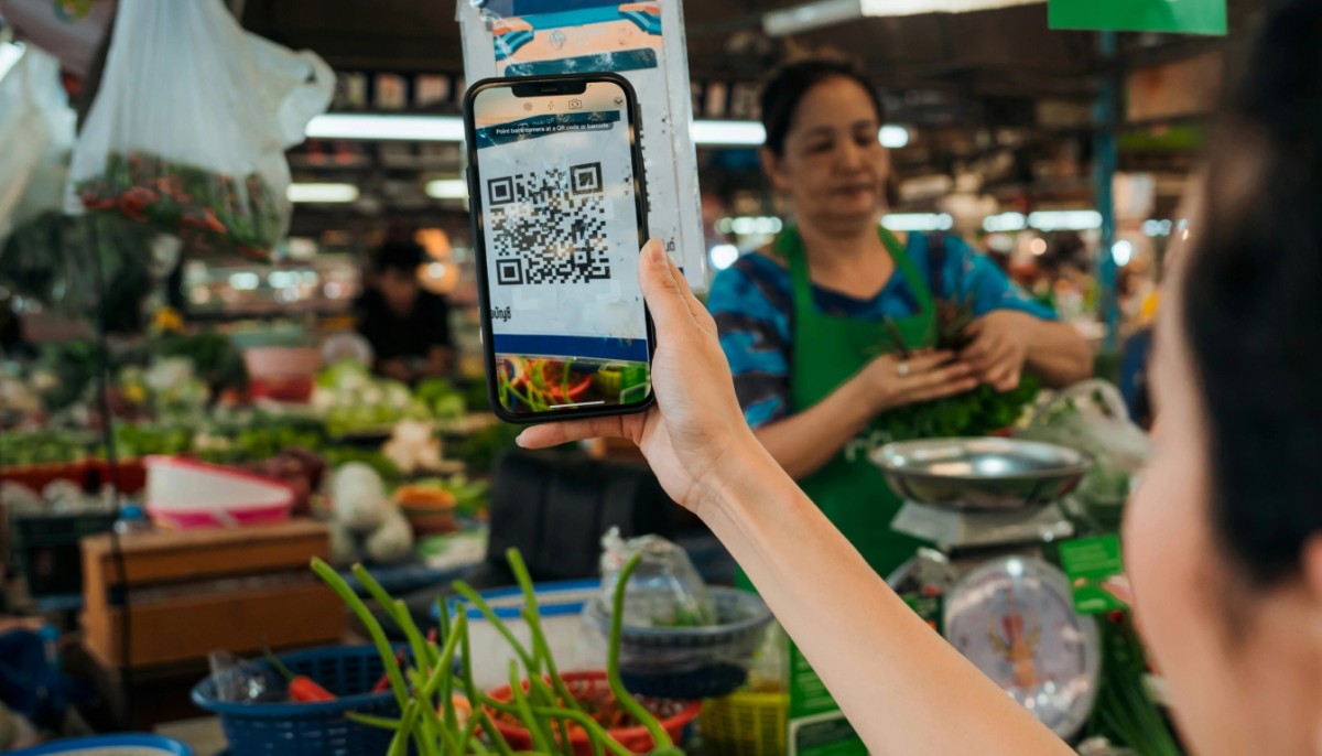 QR code scanner via smartphone on the food market