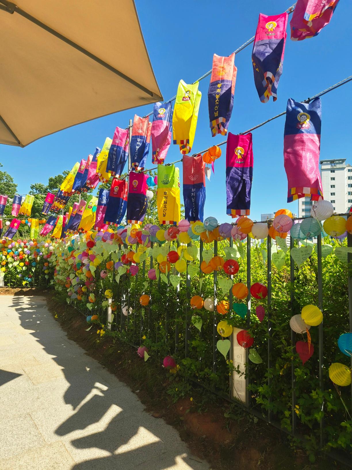 Colorful Buddhist prayer flags and small lanterns