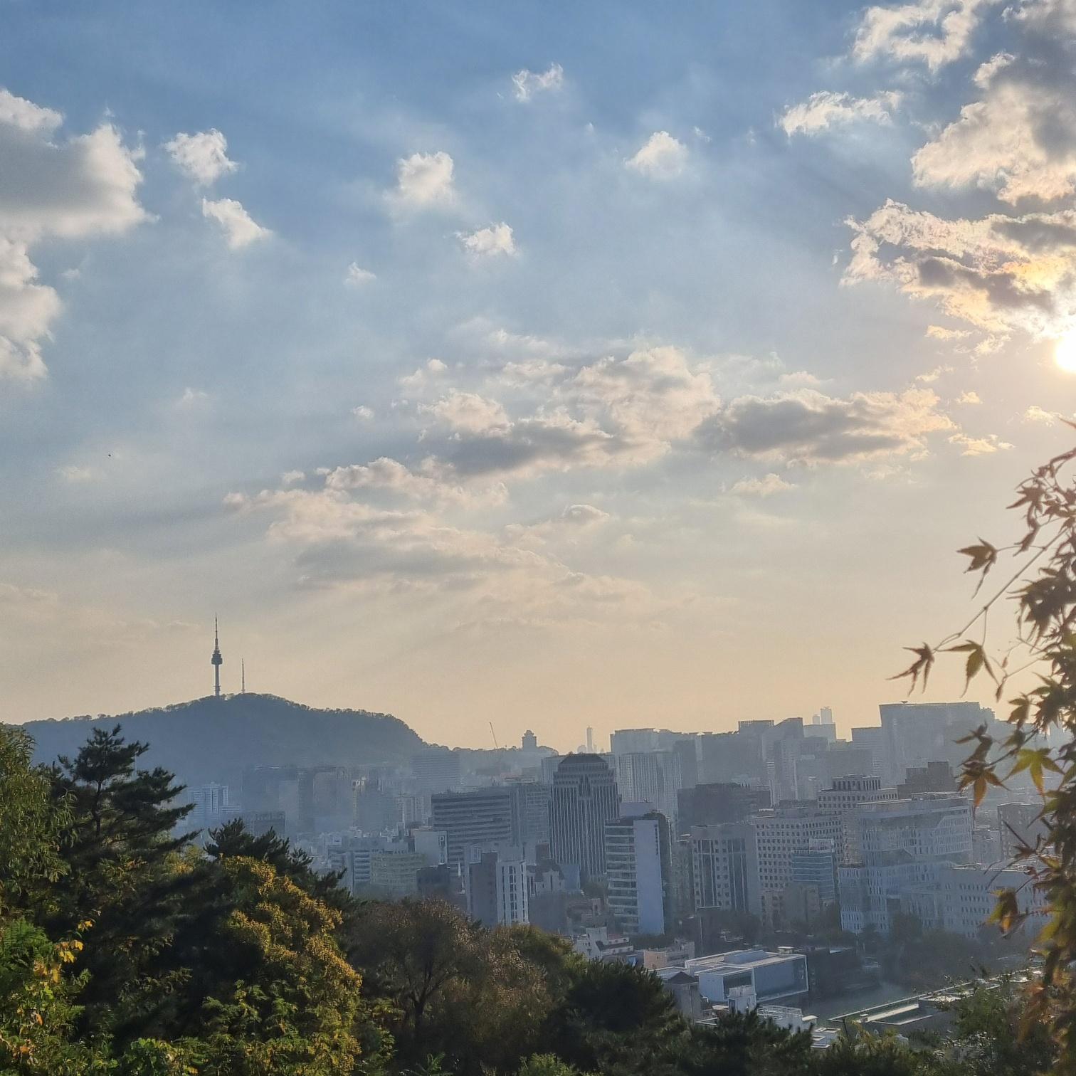 stunning silhouette of N Seoul Tower in the distance at sunset