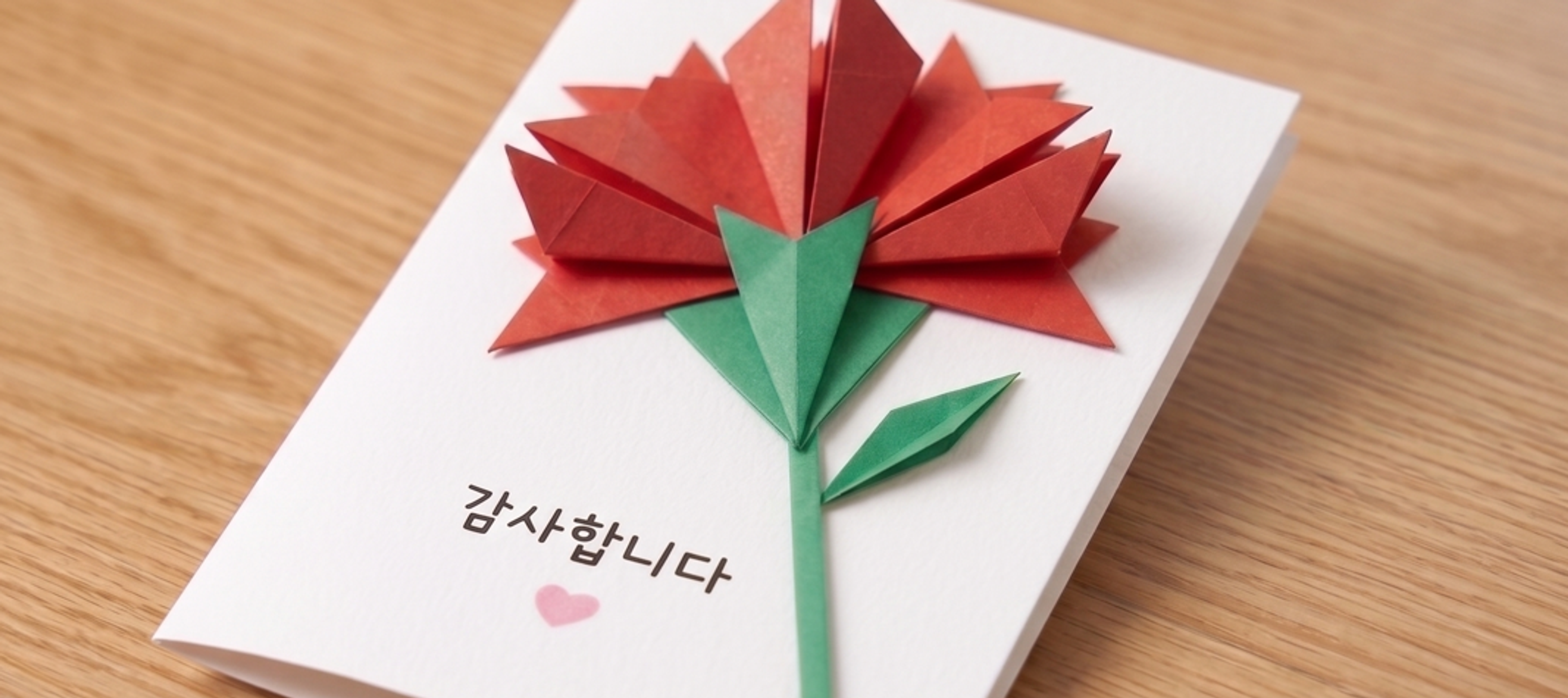 a paper-folded carnation thank-you card