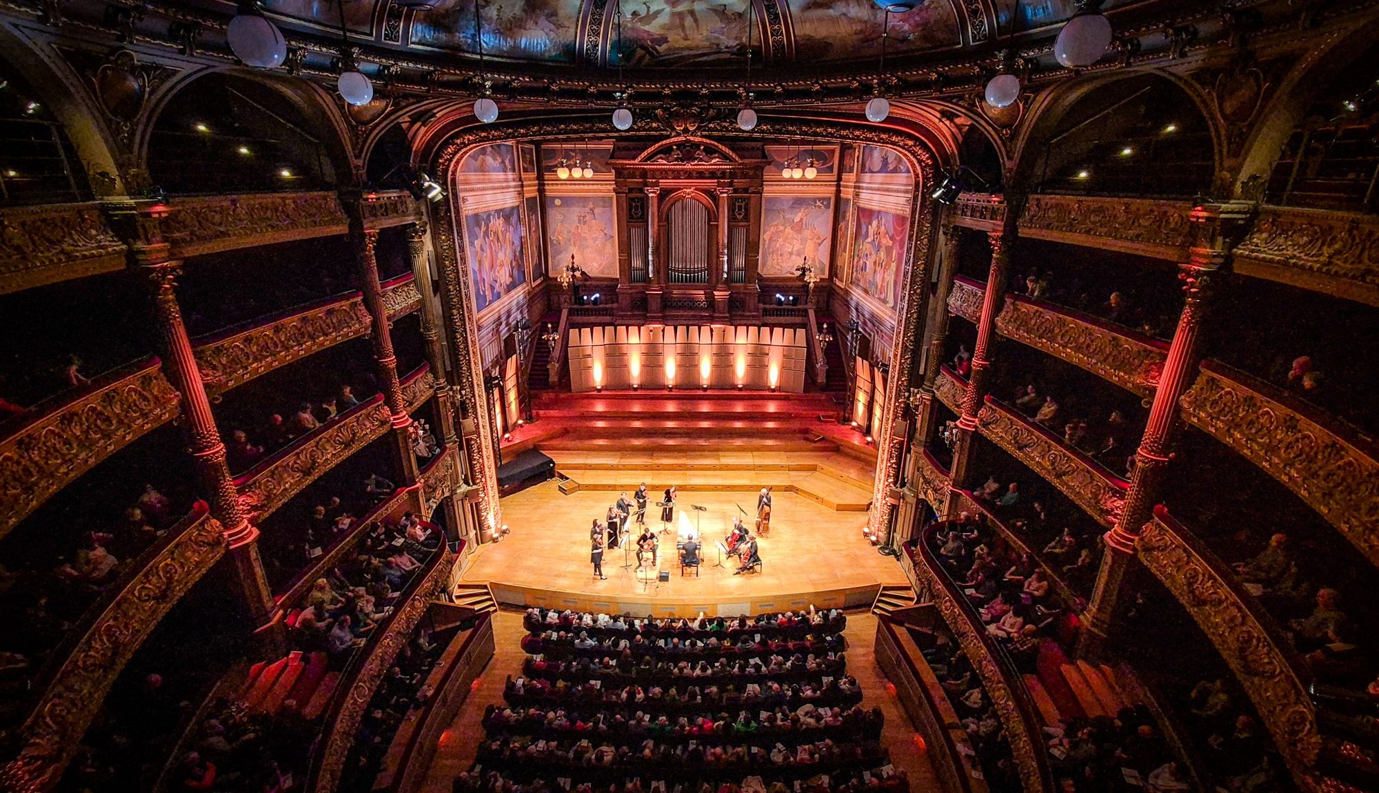 Arcangelo performing on stage in the Salle Philharmonique, Liège.