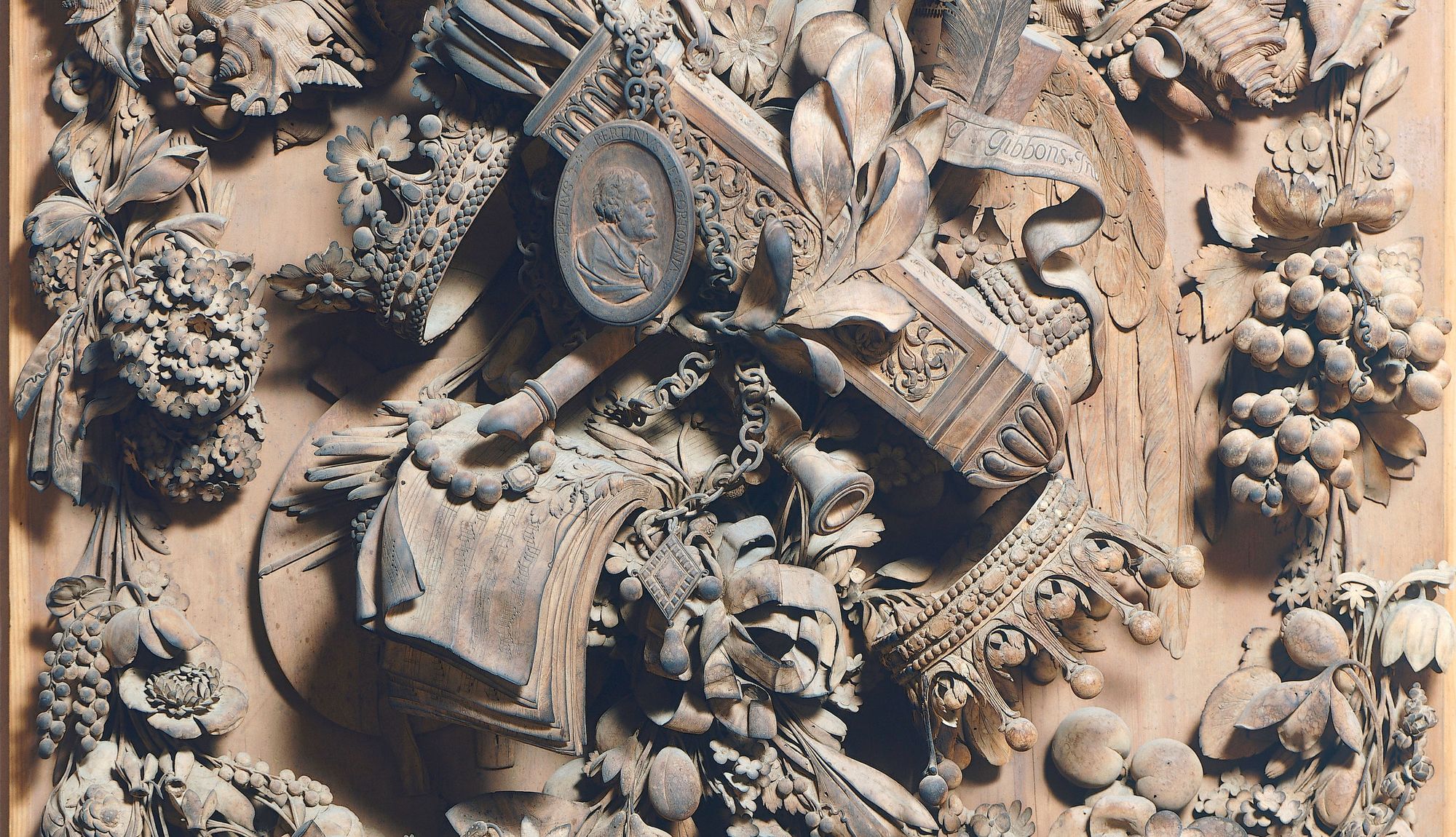 Limewood carving by Grinling Gibbons: birds, flowers and musical instruments in intricate relief.