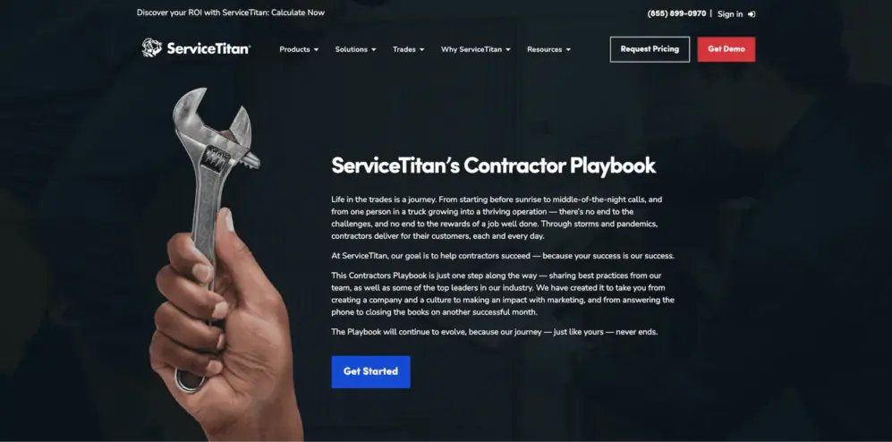Website homepage for ServiceTitan featuring a hand holding a wrench, promoting their Contractor Playbook for business success.