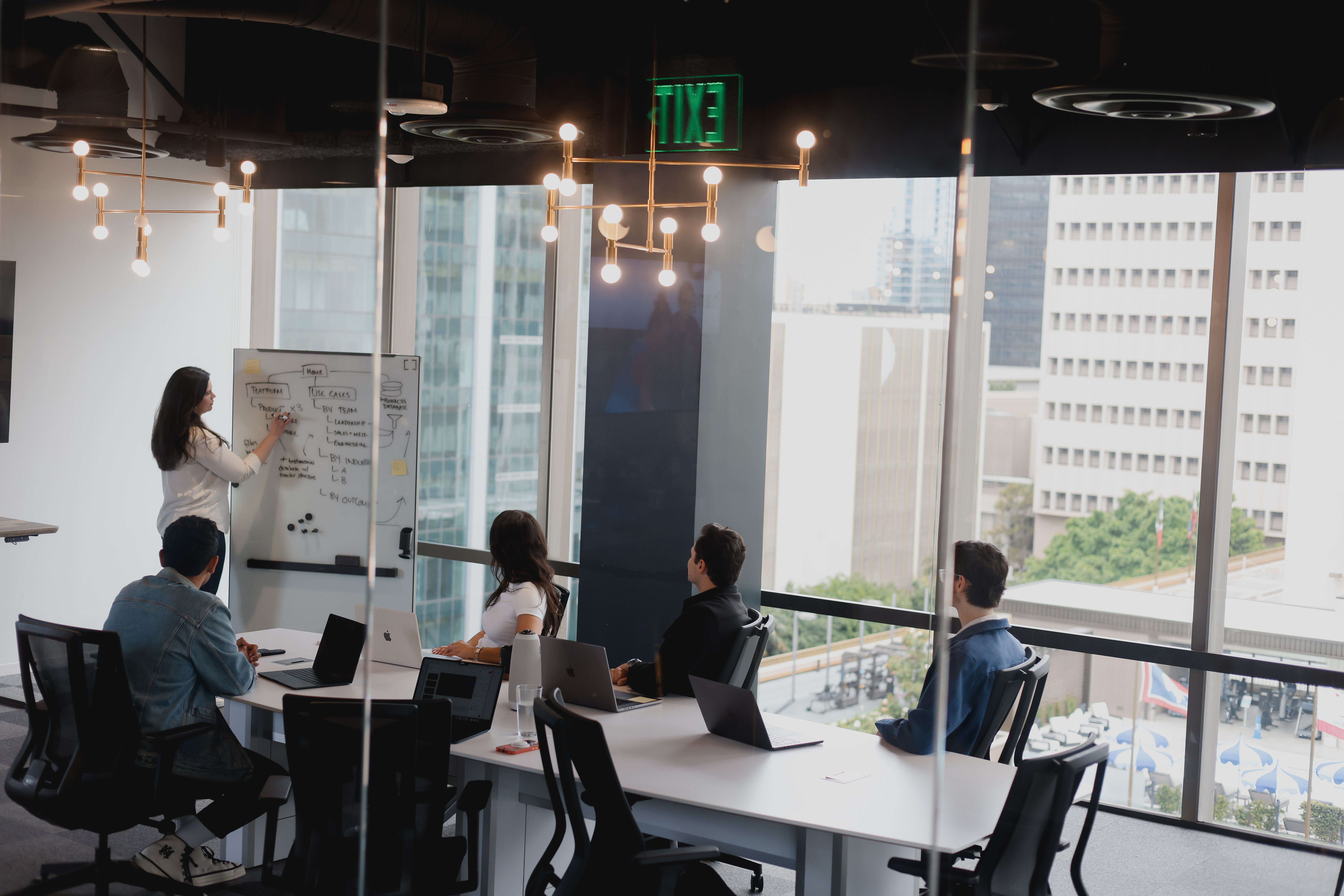 Team members discussing a website redesign in a conference room