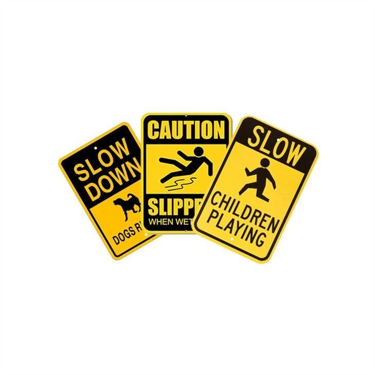 Children Playing Slow Down Sign