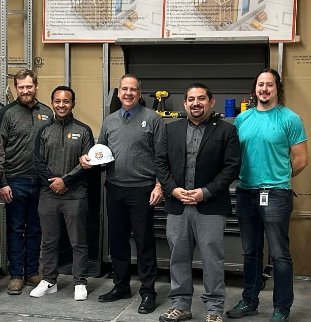Research team with the President of Idaho State University in the structural laboratory