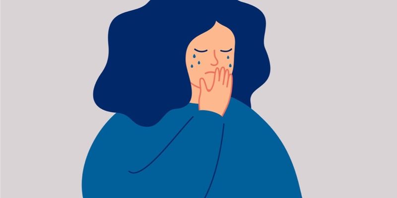 Illustrasjon av en kvinne som er lei seg og gråter.