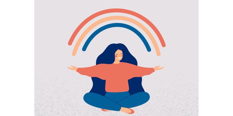 Illustration af en kvinde der mediterer med en regnbue over hovedet
