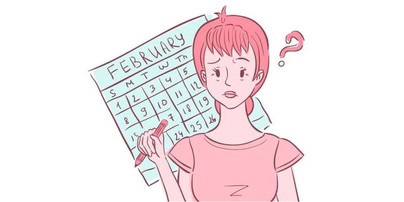 Ung kvinne som noterer sin menstruasjon i en kalender