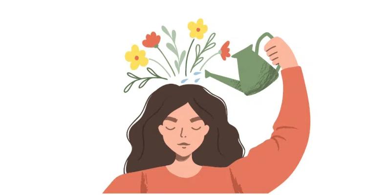 Kvinne som vanner blomstene som vokser på hodet hennes