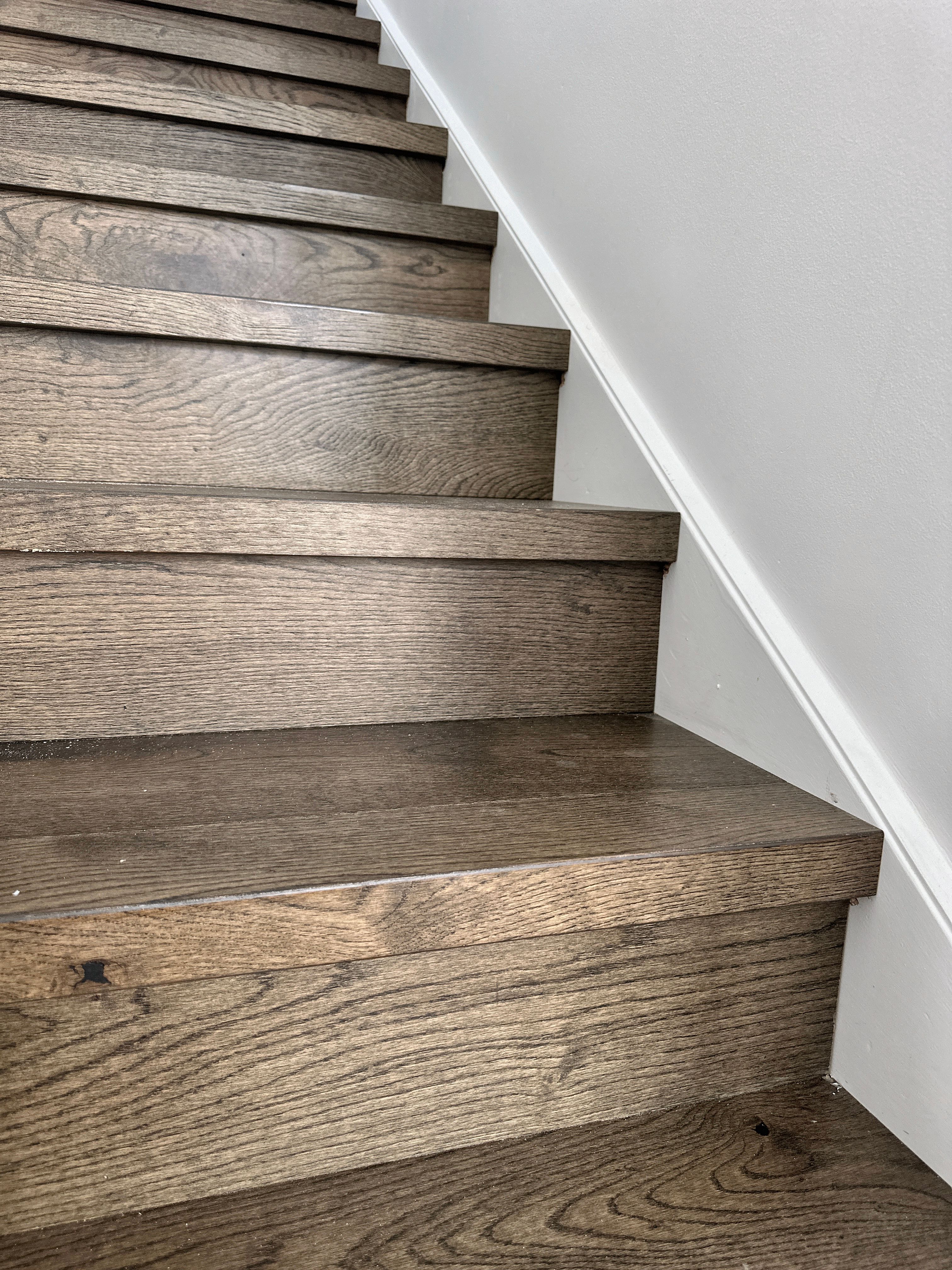French Grey engineered oak flooring and matching custom stair nosing in Toorak.