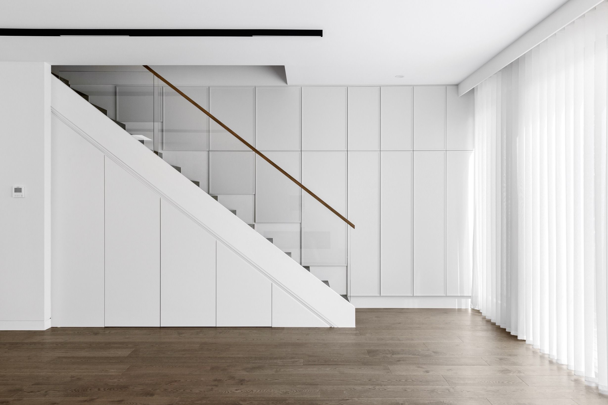 French Grey oak flooring across a Glen Iris living area and staircase.