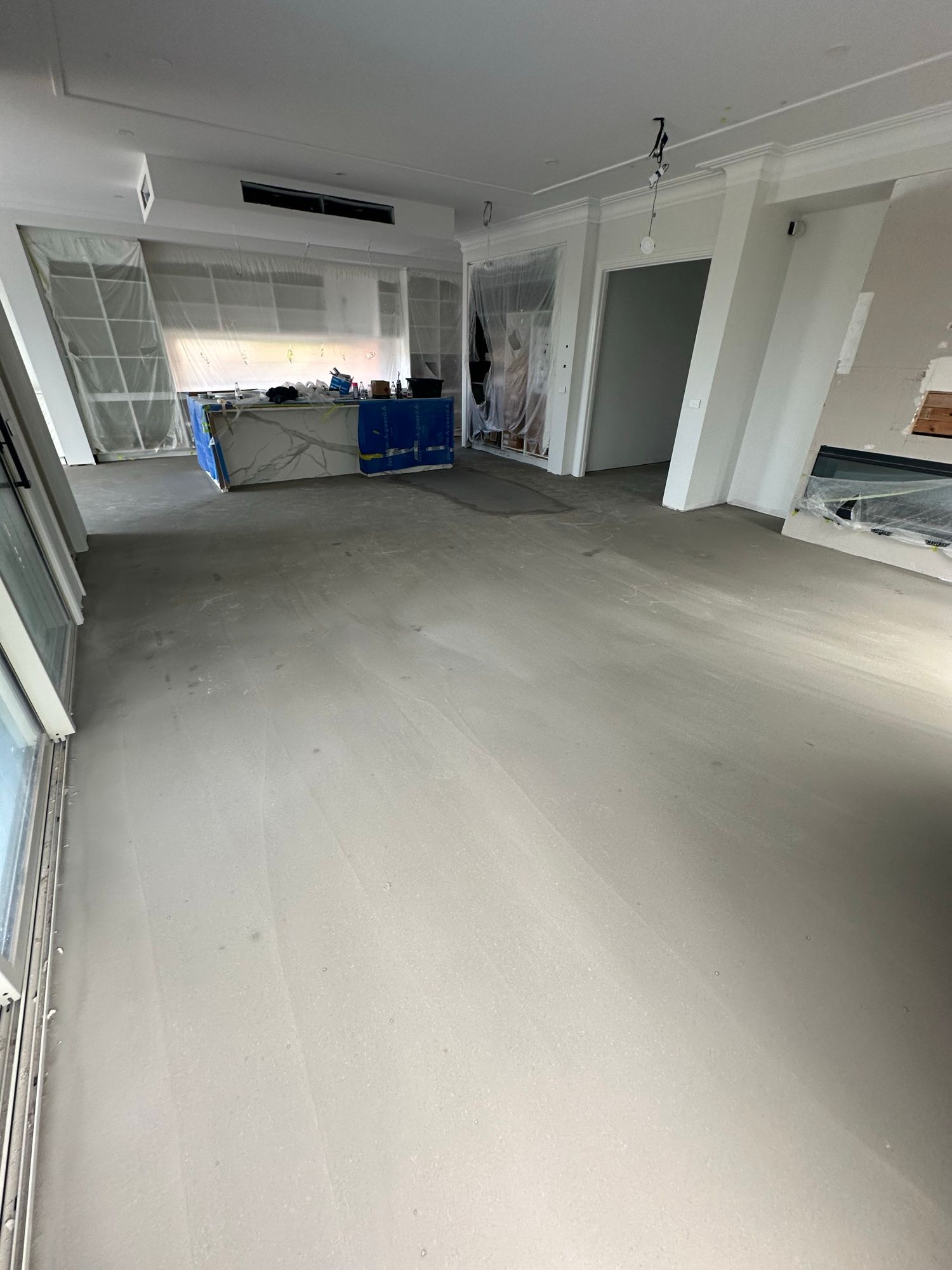Dry and level residential subfloor after whole-home self-levelling work.