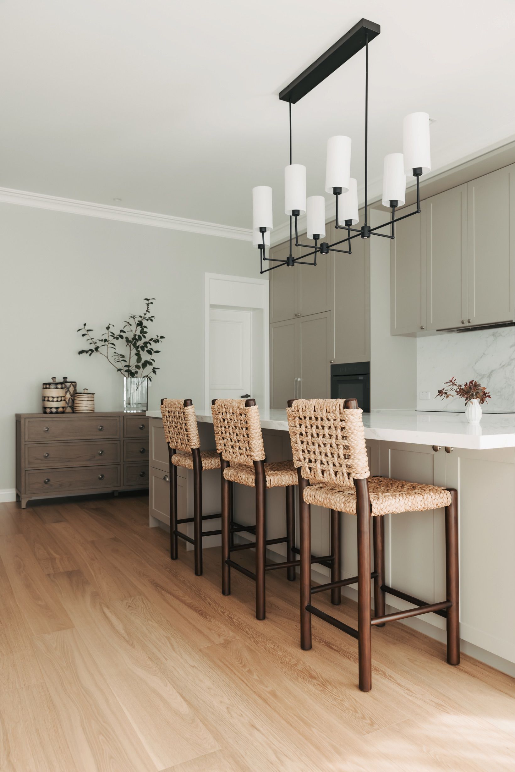 Chesterfield engineered oak flooring through a bright Canterbury kitchen.