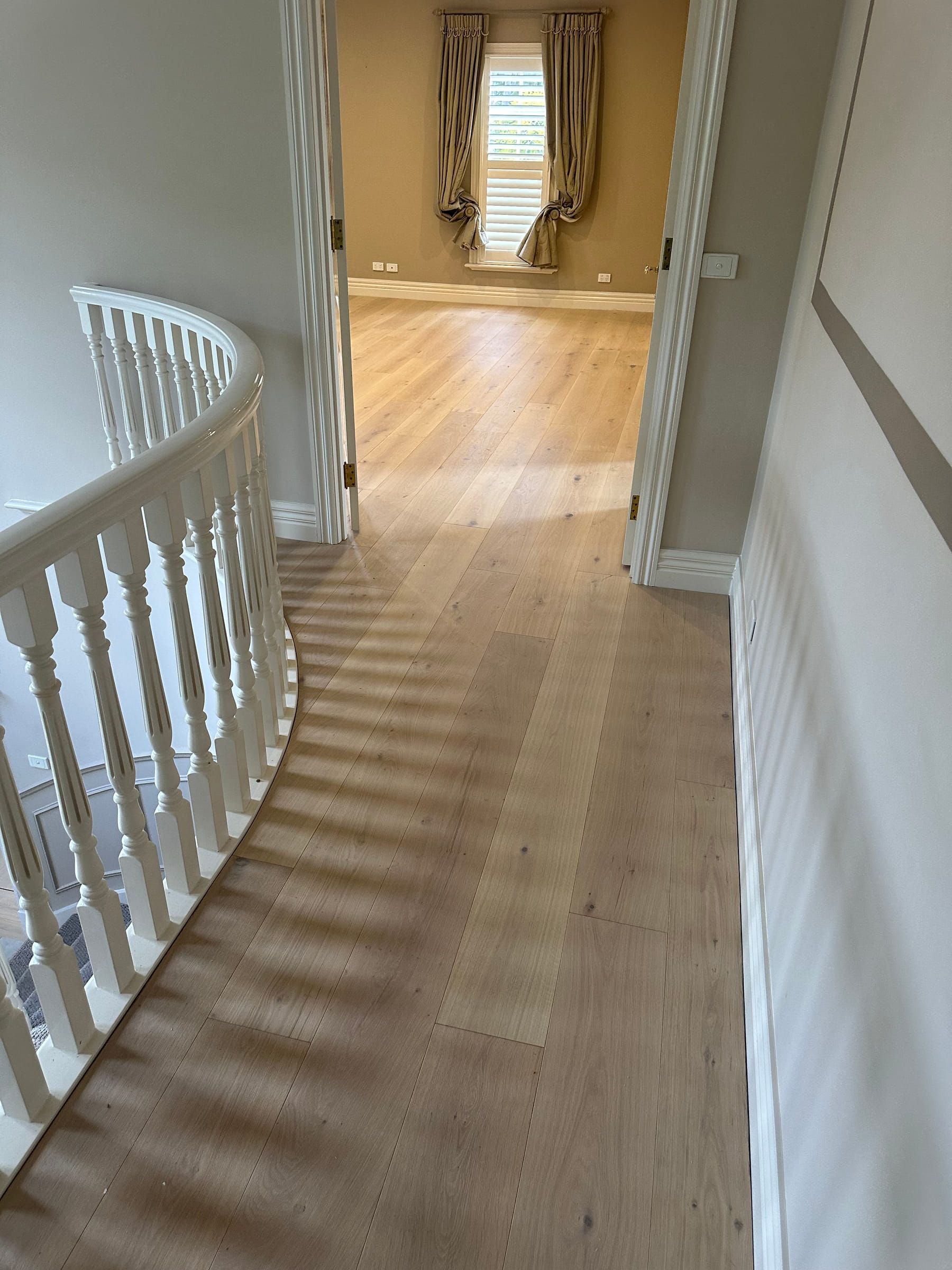Tealight engineered oak flooring approaching an upstairs landing in Camberwell.