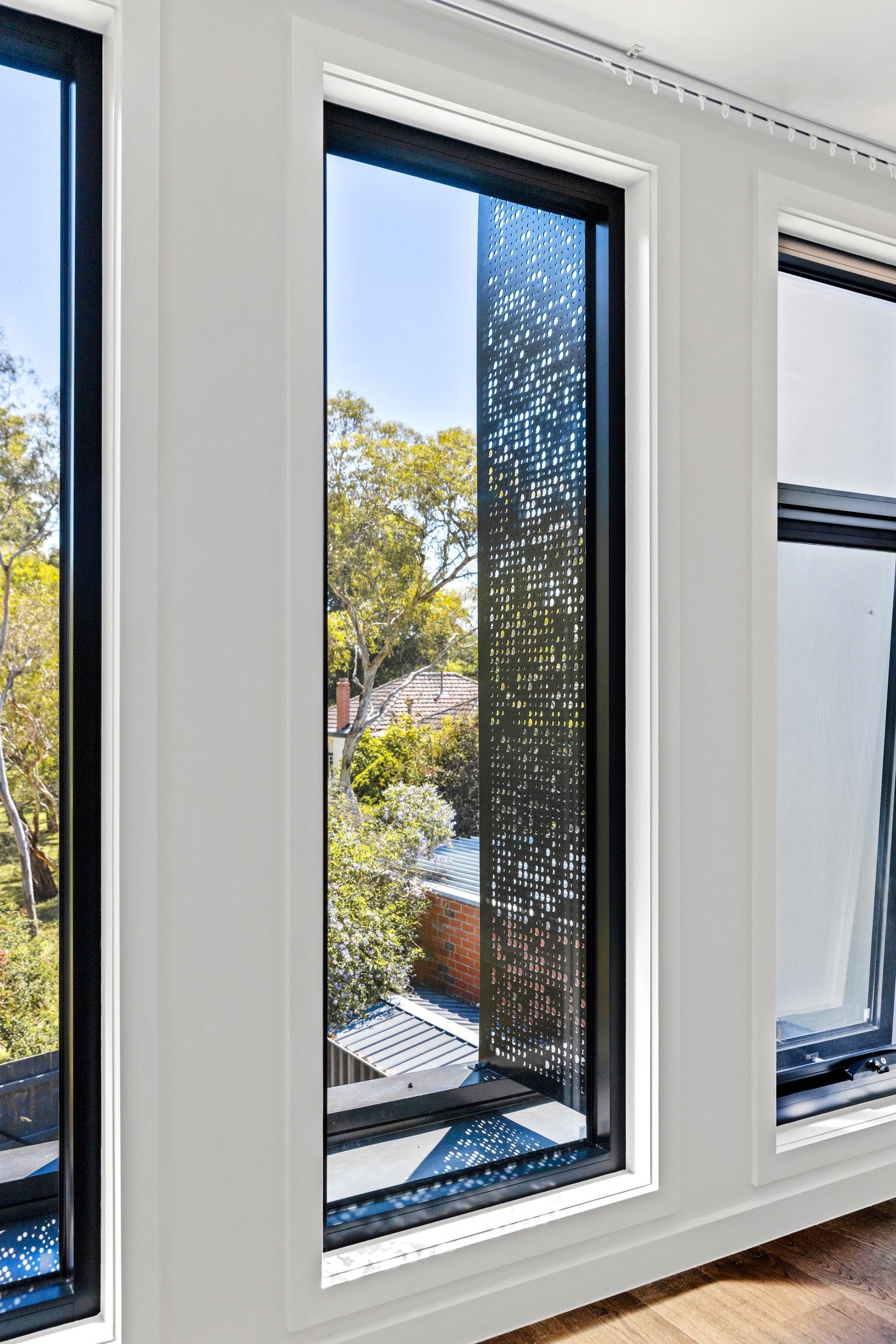 Black-framed window detail in the completed Glen Iris residence.