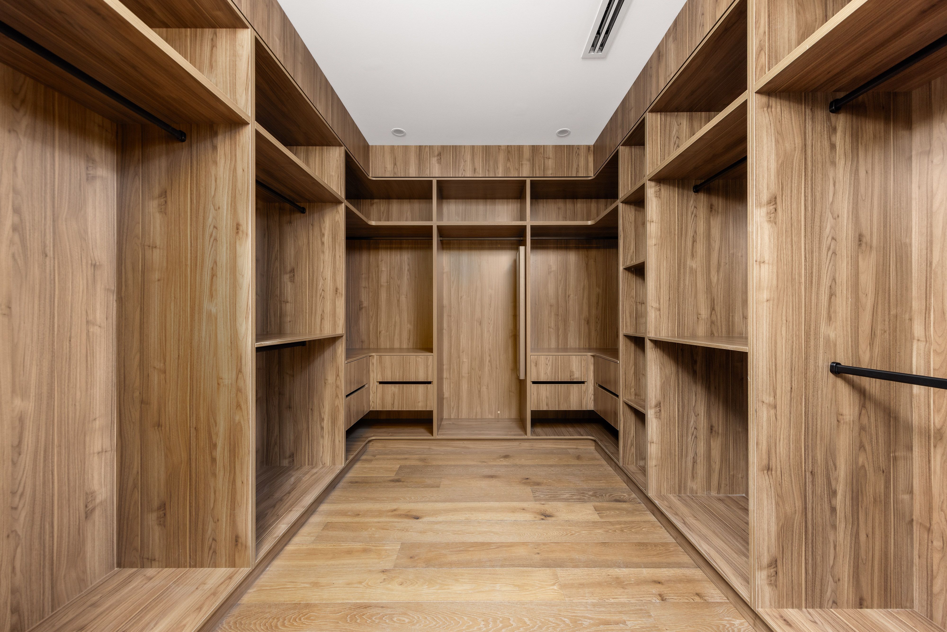 Smoked Brown oak flooring inside a timber-lined Balwyn walk-in wardrobe.