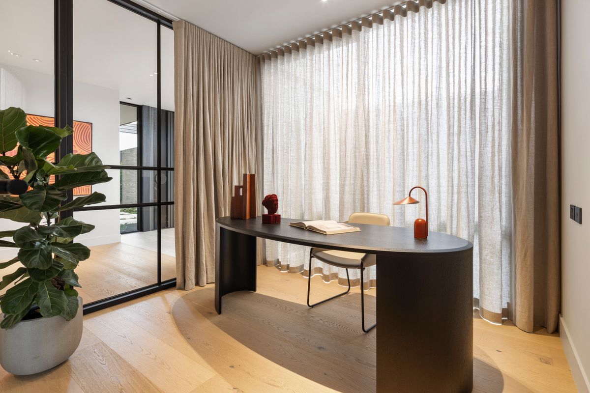 Avoca Bay engineered oak flooring in a Kew home office with curved glass walls.