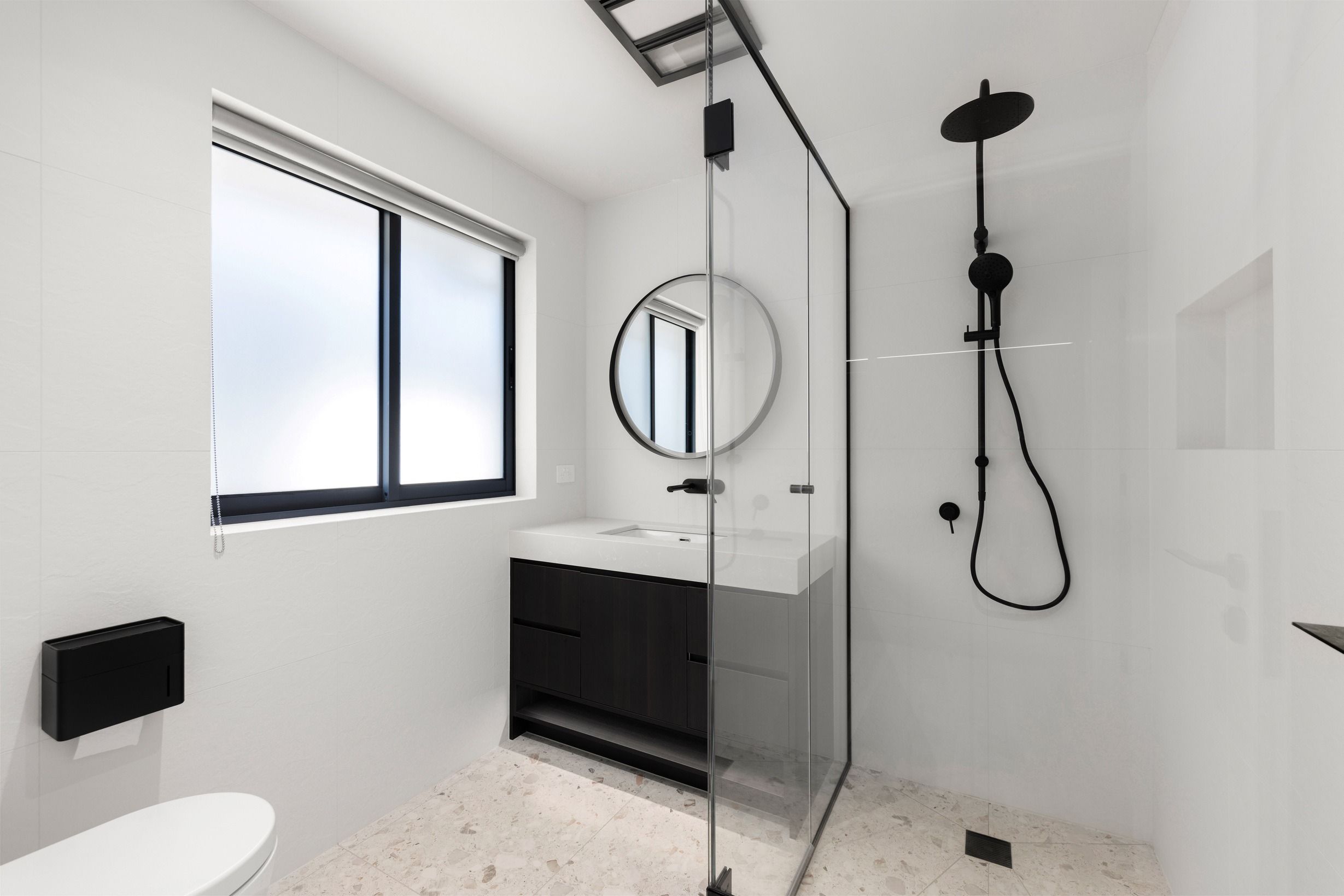 Black bathroom fixtures in the completed Wheelers Hill residence.