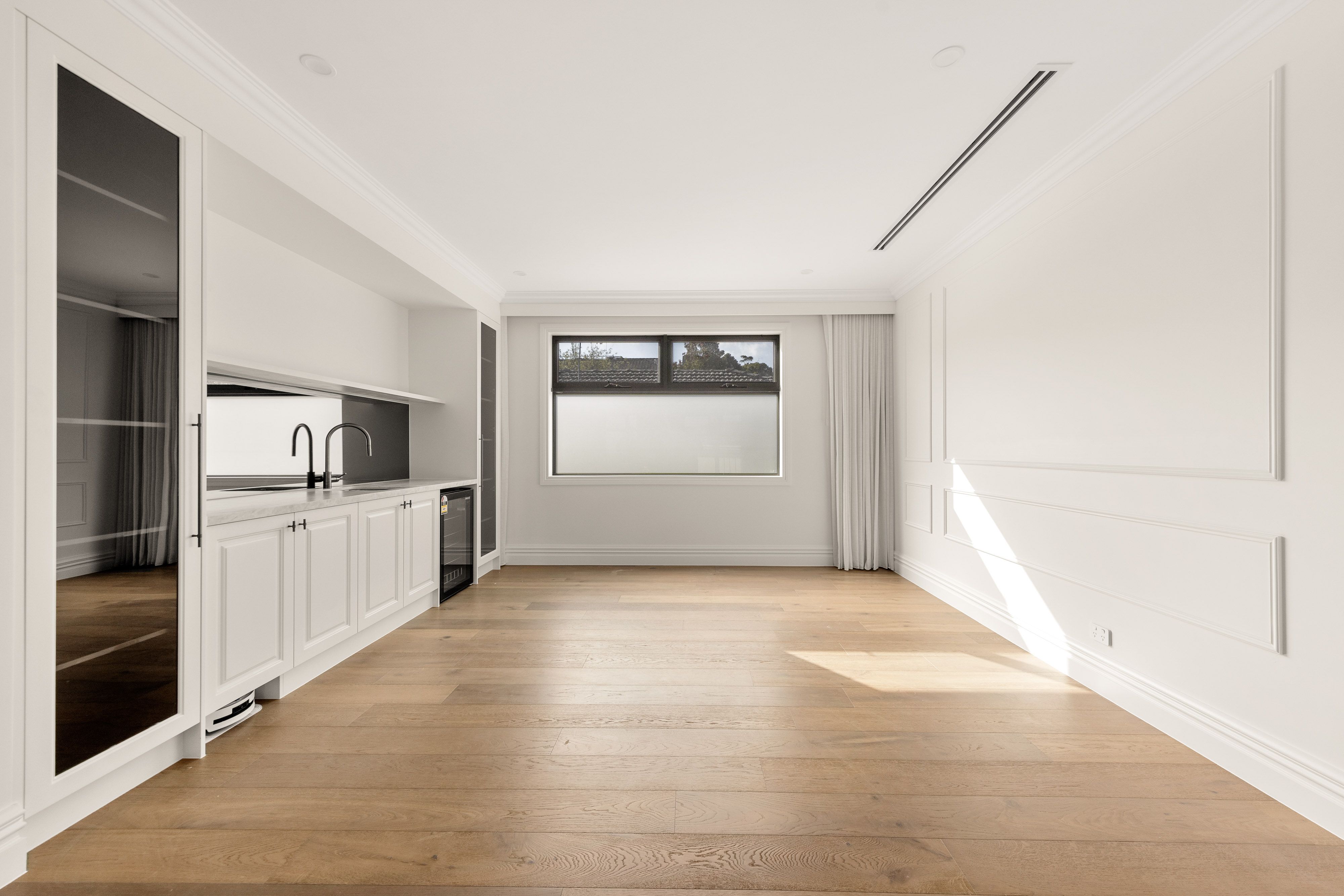 Smoked Brown straight-plank flooring in a Balwyn kitchenette and living space.