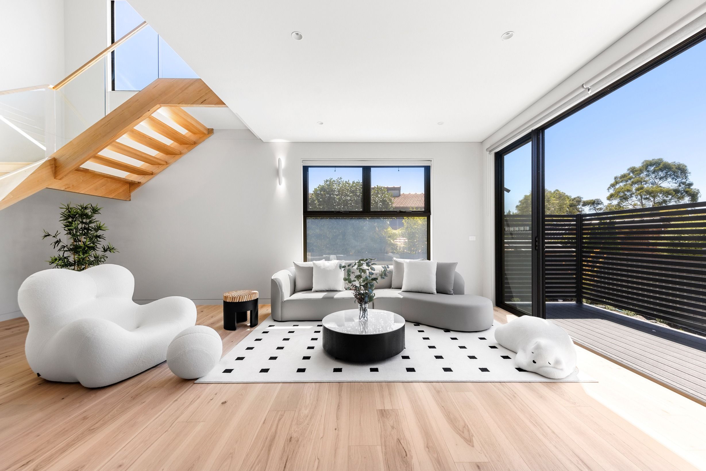 Danehill Hickory flooring in a Wheelers Hill living room with open timber staircase.