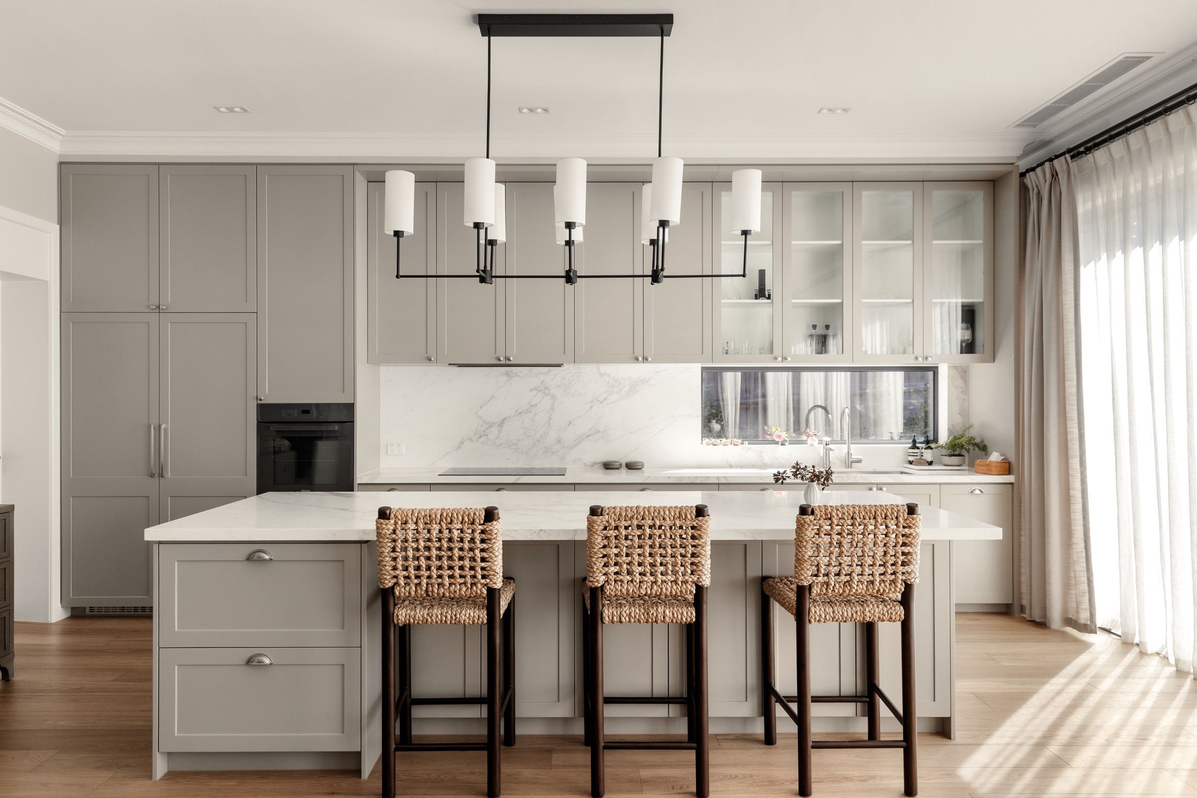 Chesterfield oak flooring around the kitchen island and cabinetry in Canterbury.