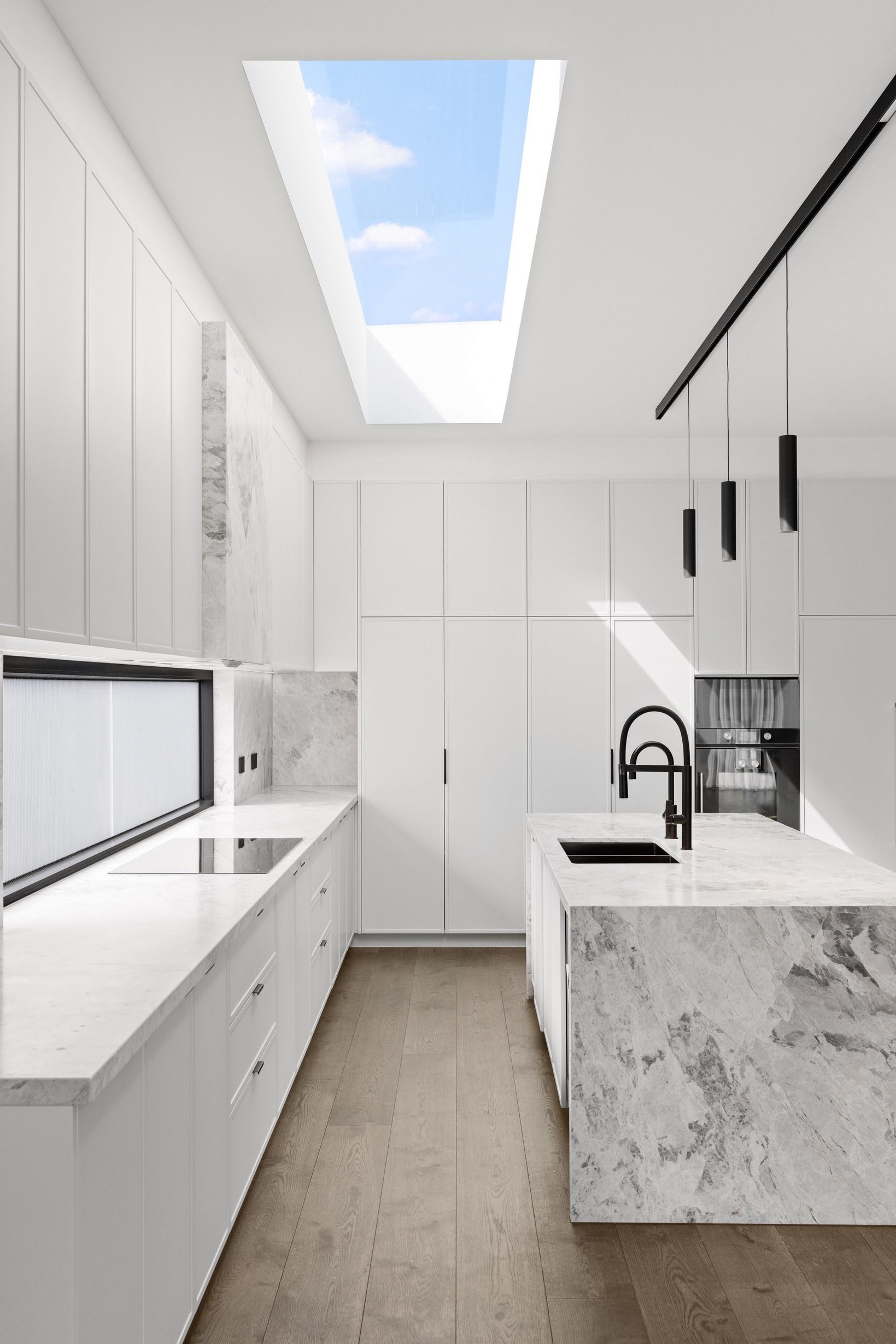 French Grey engineered oak flooring along a bright Glen Iris kitchen.
